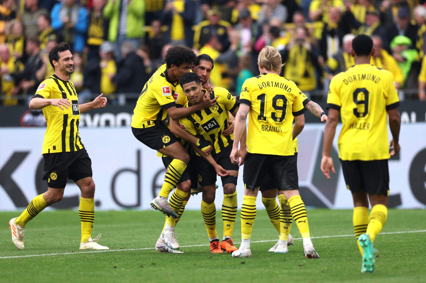 DORTMUND, GERMANY - MAY 07: Jude Bellingham (C) of Borussia Dortmund celebrates with Karim Adeyemi (2L), Emre Can and teammates after scoring the team's fourth goal during the Bundesliga match between Borussia Dortmund and VfL Wolfsburg at Signal Iduna Park on May 07, 2023 in Dortmund, Germany. (Photo by Lars Baron/Getty Images)