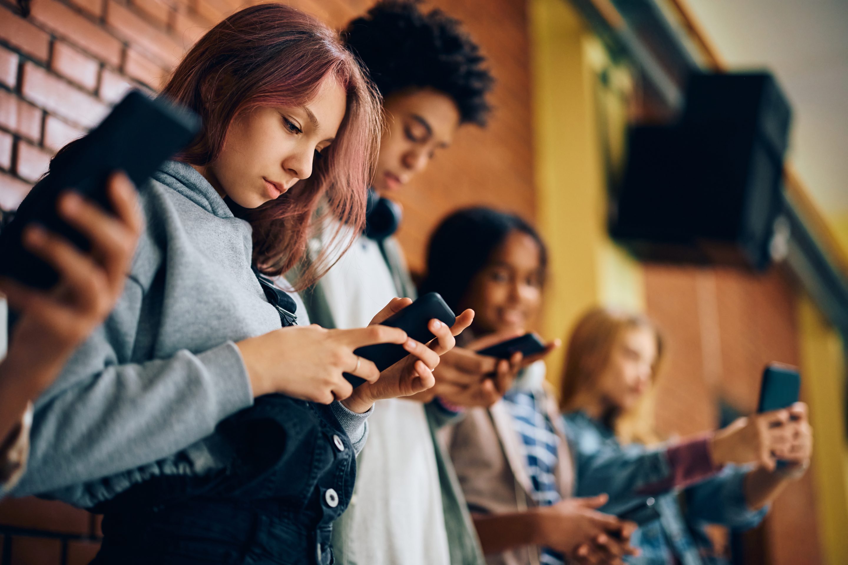 teenagers using mobile phones