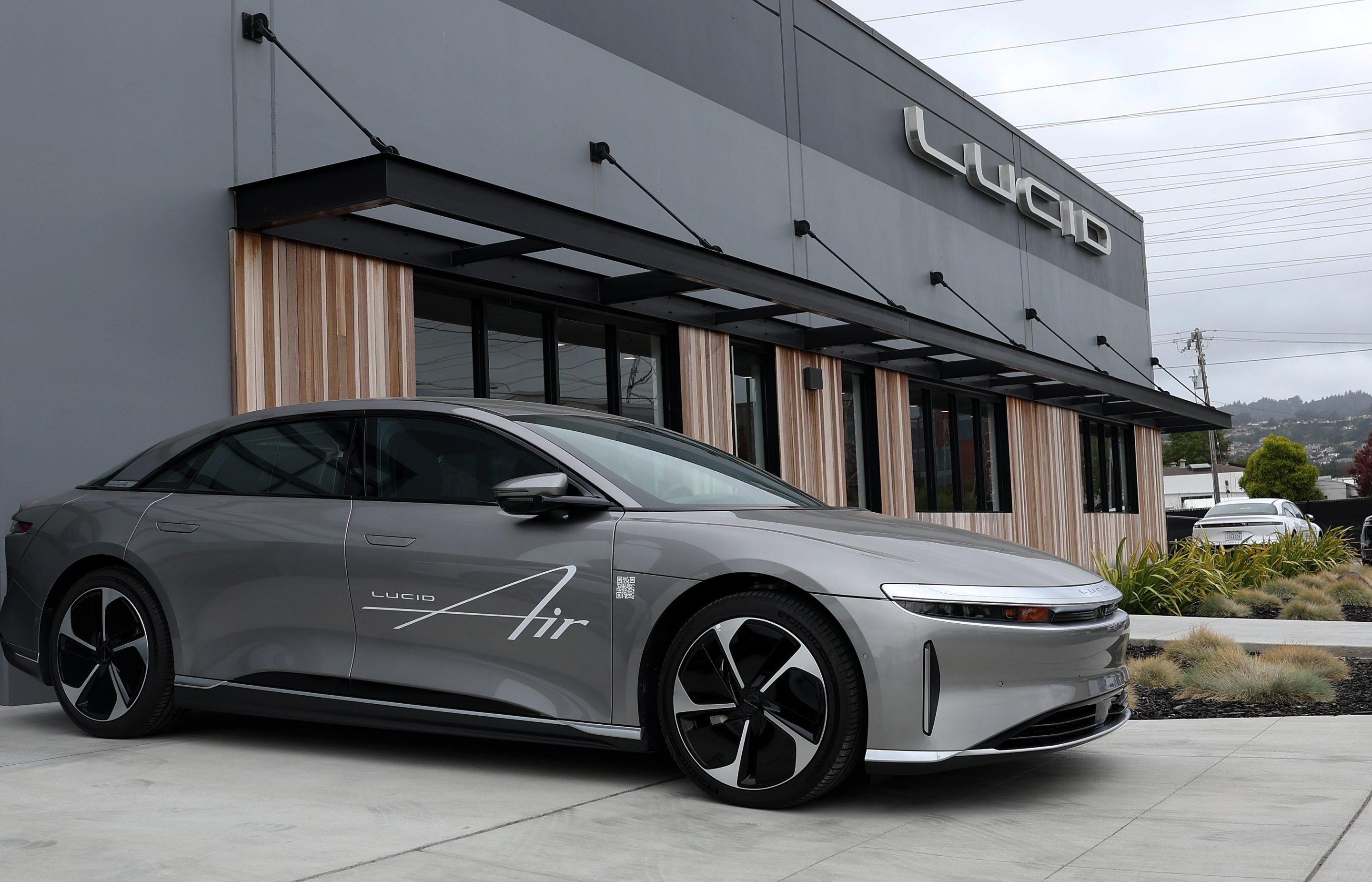Brand new Lucid electric cars sit parked in front of a Lucid Studio showroom on May 24, 2024 in San Francisco.