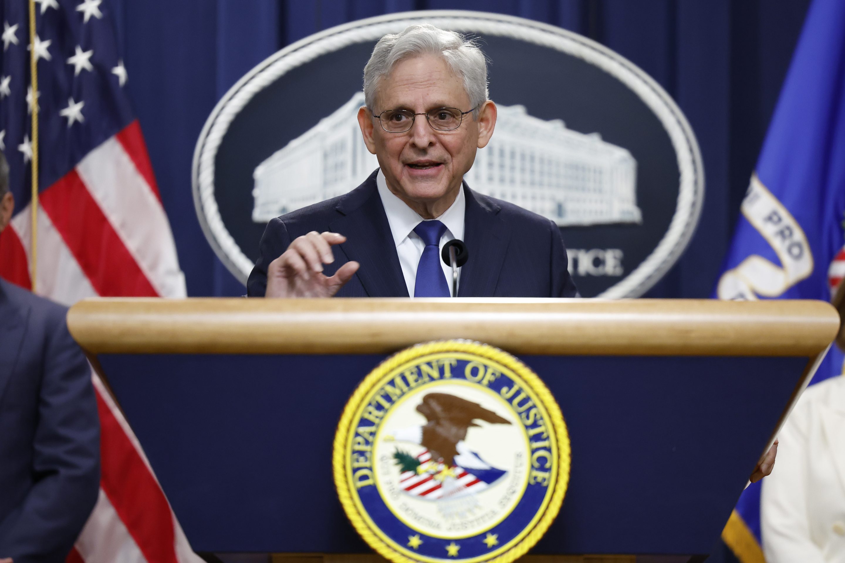 Attorney General Merrick Garland speaks during a press conference at the U.S. Department of Justice on Friday.