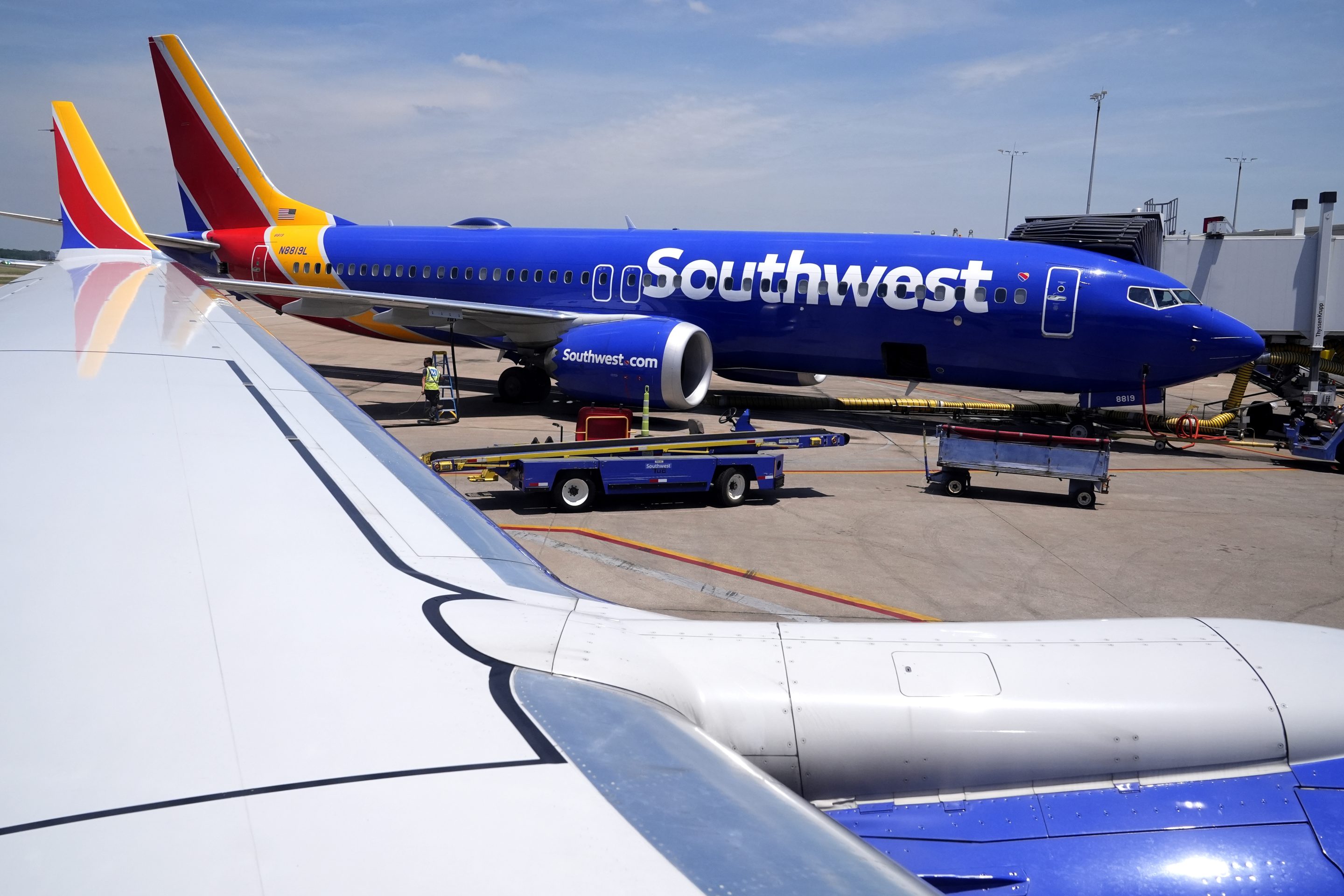 A Southwest Airlines Boeing 737 passenger jet sits at a gate at the Tulsa International Airport on June 15, 2024.