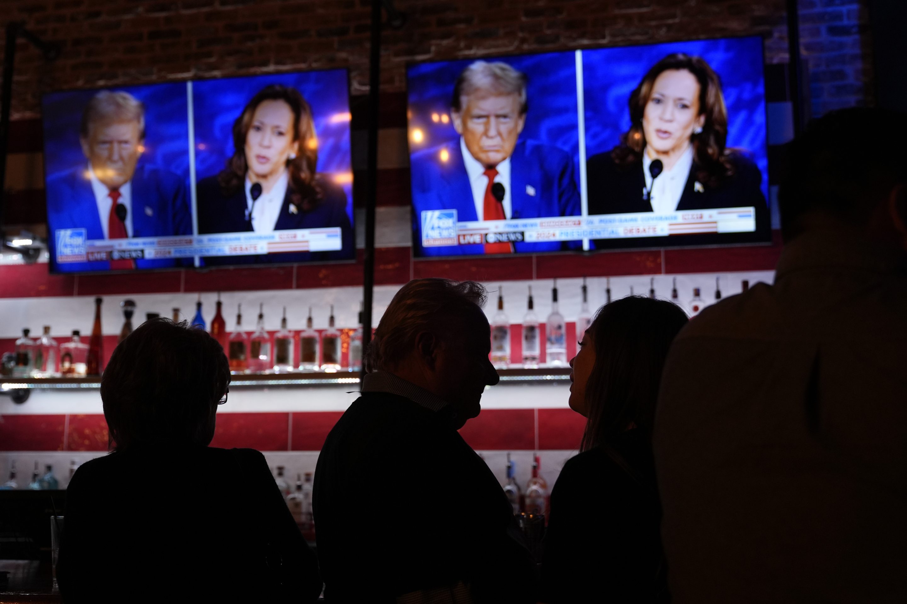 Viewers gather to watch a debate between Democratic presidential nominee Vice President Kamala Harris and Republican presidential nominee former President Donald Trump at the Angry Elephant Bar and Grill, on Sept. 10, 2024, in San Antonio. 