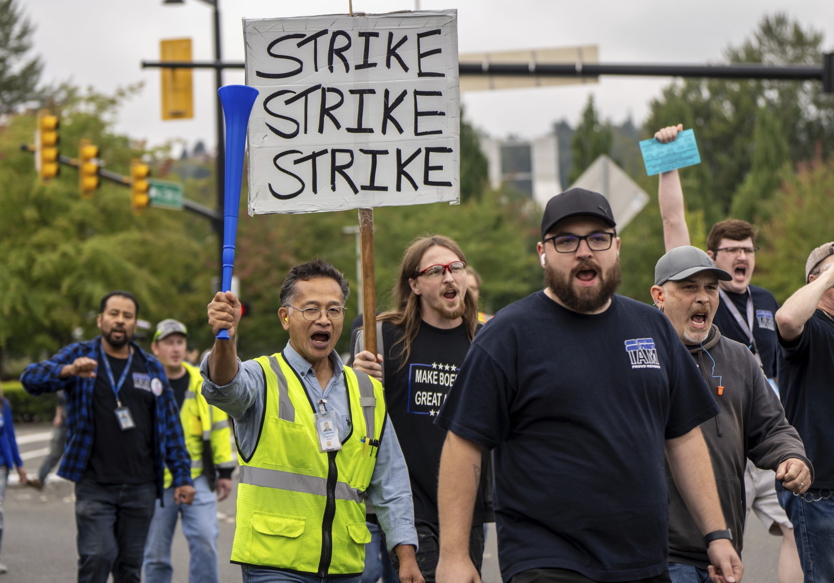 International Aerospace Machinists union members march toward the union's hall to vote on a contract offer with airplane maker Boeing, on Thursday, Sept. 12, 2024, in Renton, Wash.