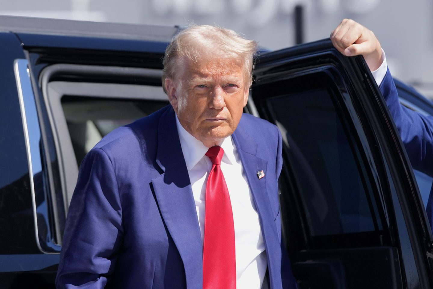 Donald Trump steps out of car
