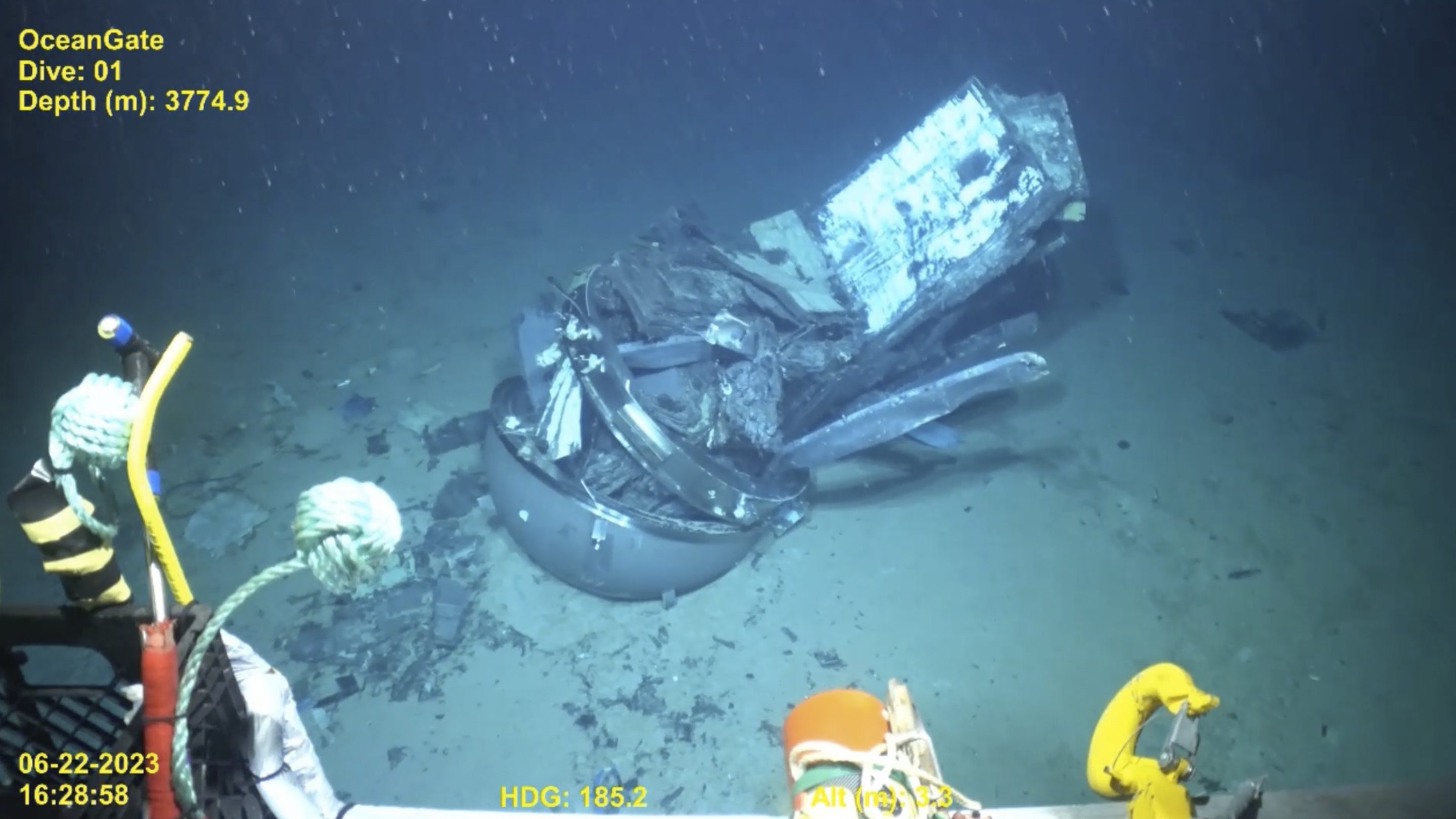 The remains of the Titan submersible, center, on the floor of the Atlantic Ocean.