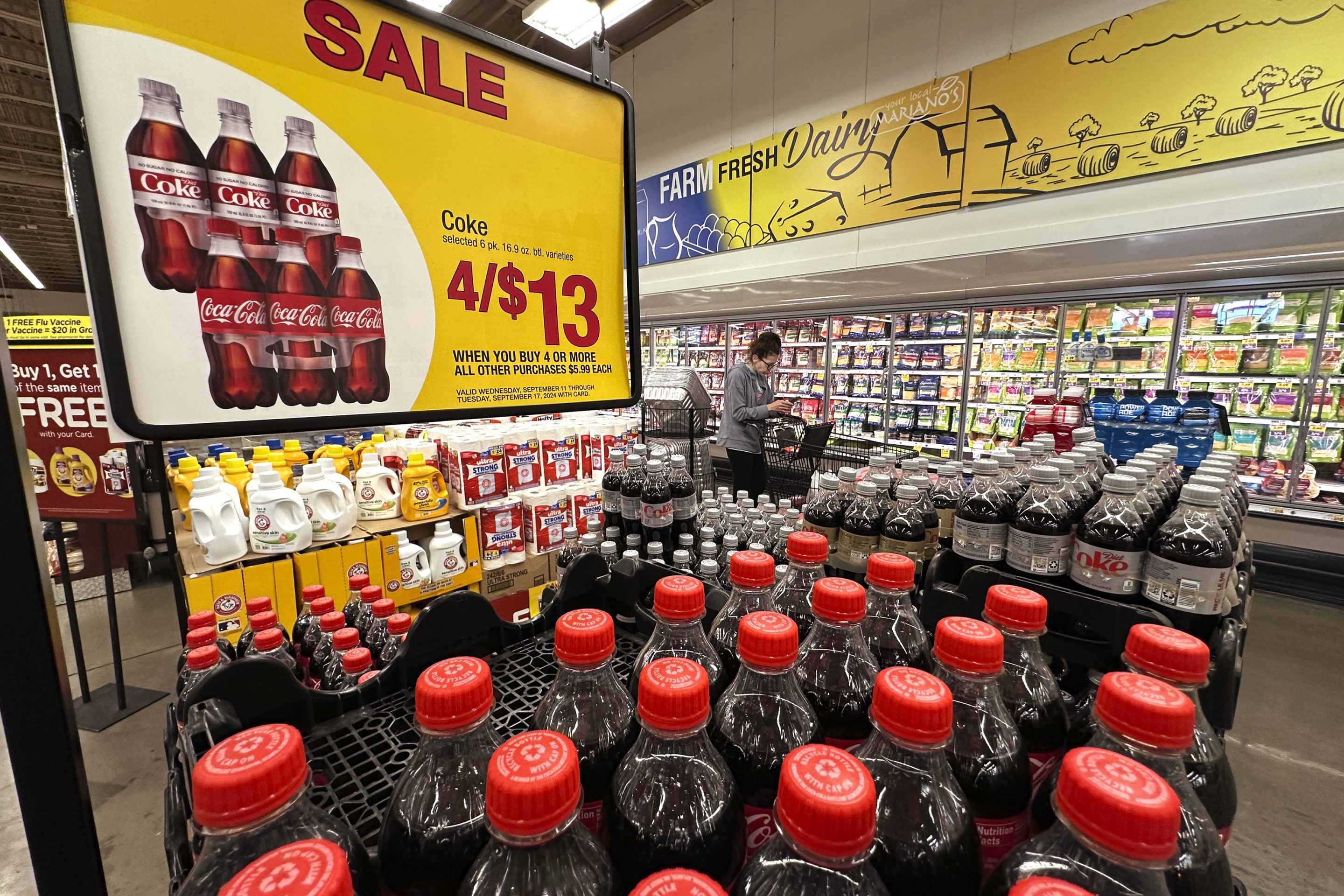 A customer passes an array of beverages while shopping at a grocery store in Chicago, on Sept. 19, 2024.