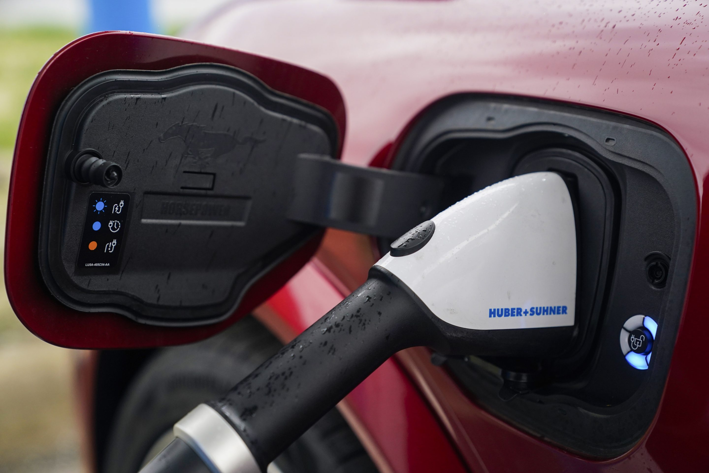 A 2023 Ford Mustang Mach-E charges, on March 8, 2024, at an electric vehicle charging station in London, Ohio.