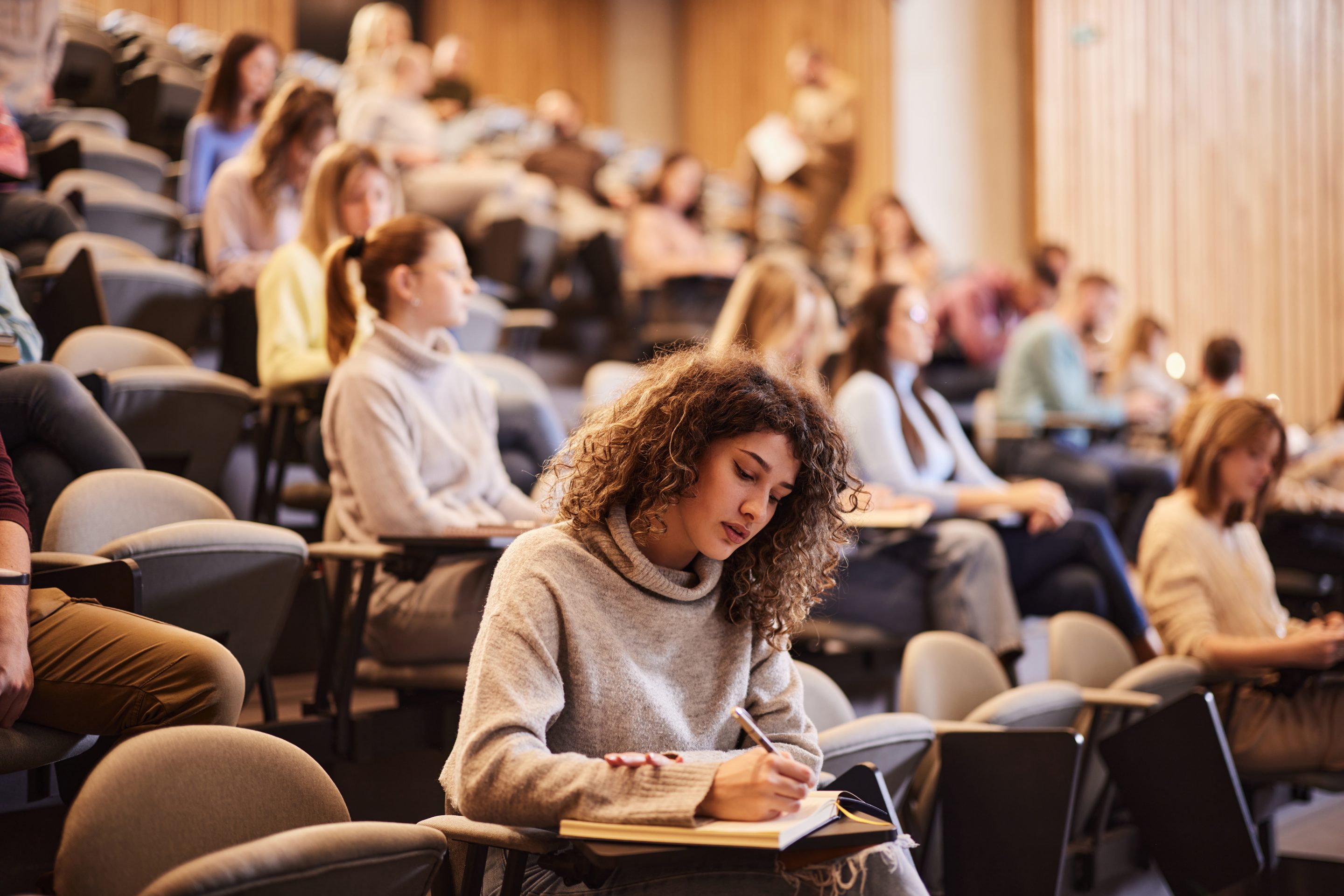 College student studies in classroom.