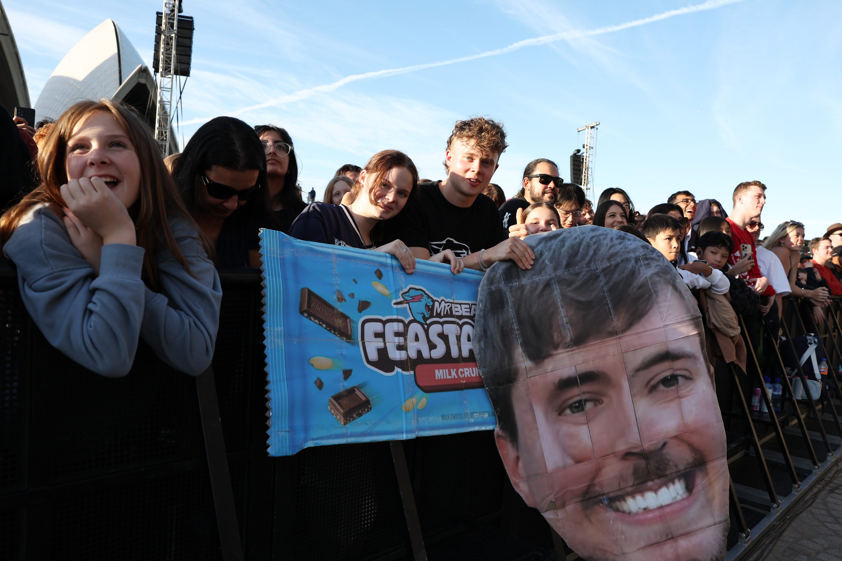 ans look on during the MrBeast Feastables launch at Sydney Opera House on June 26, 2024 in Sydney, Australia.
