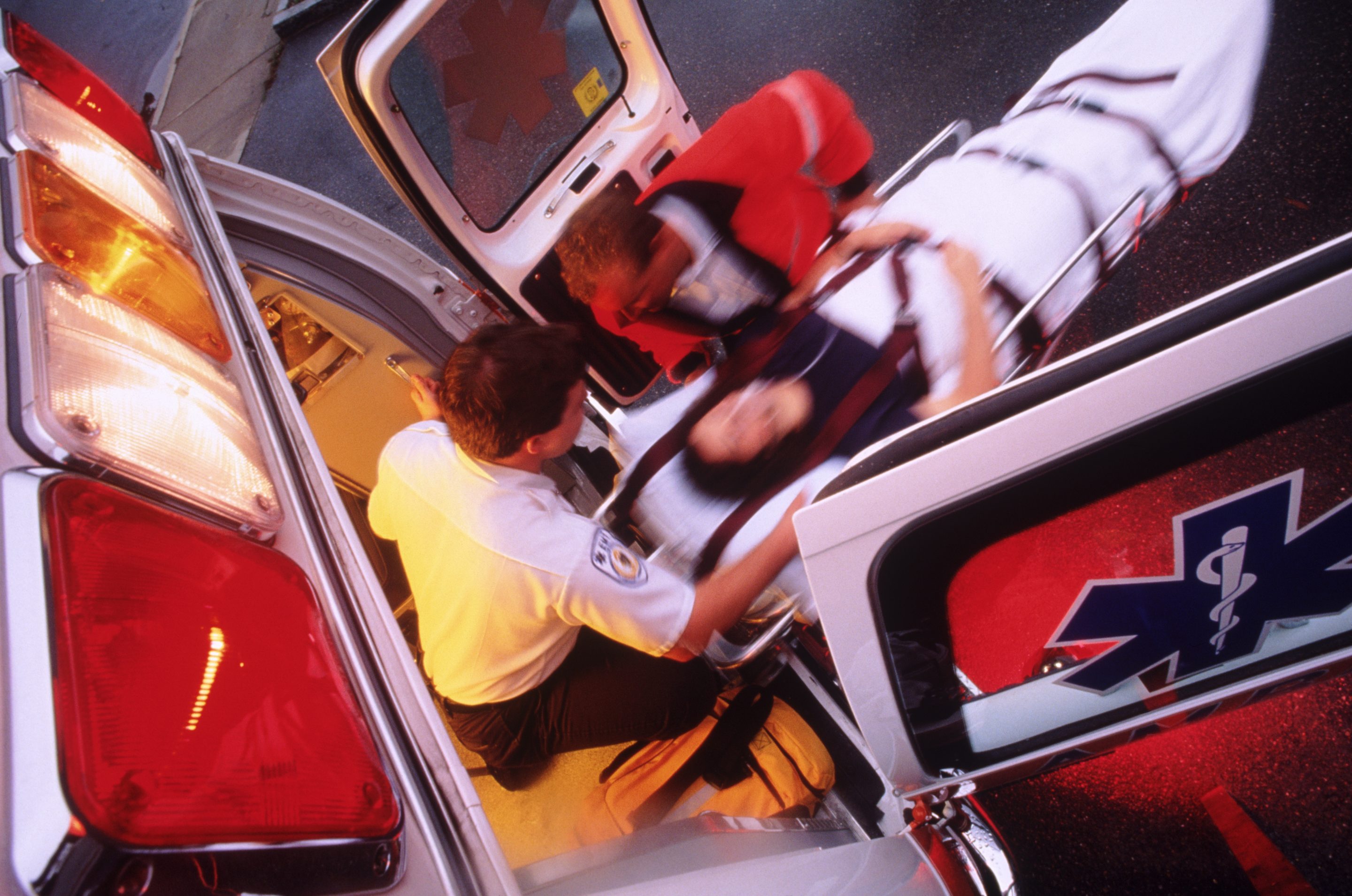 Emergency squad helps ailing patient.