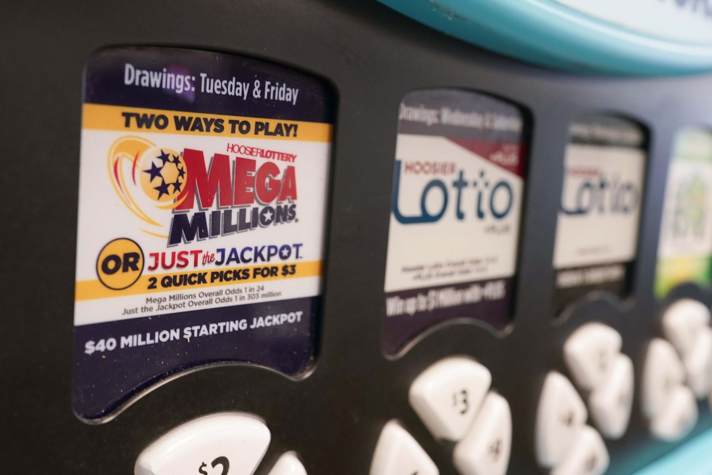 A Mega Millions logo is displayed on a vending machine at the Hoosier Lottery booth at the Indiana State Fair, on Aug. 3, 2023, in Indianapolis.