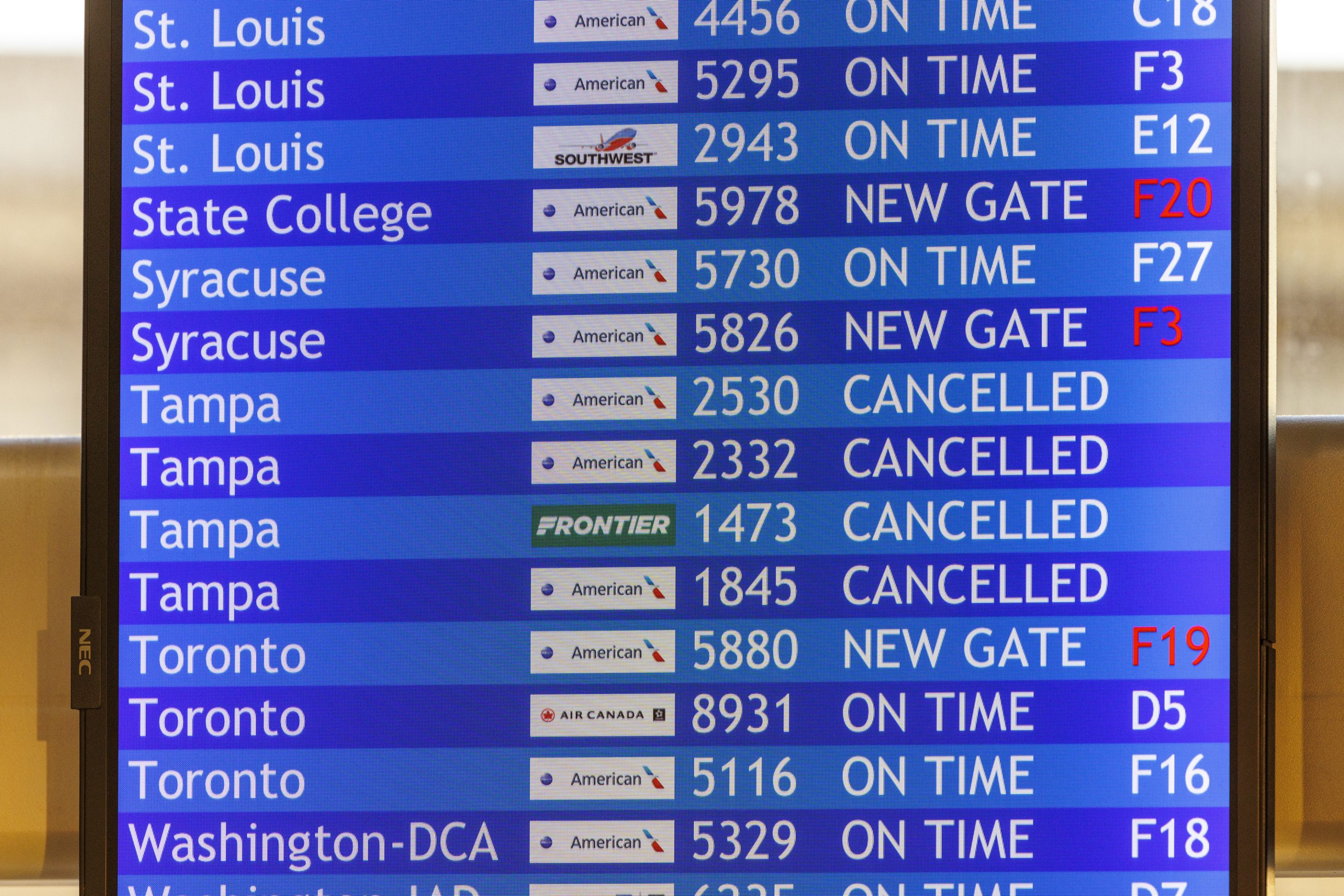 Flight information board with cancelled flights to Tampa is shown on Wednesday, Oct. 9, 2024 at the Philadelphia International Airport.
