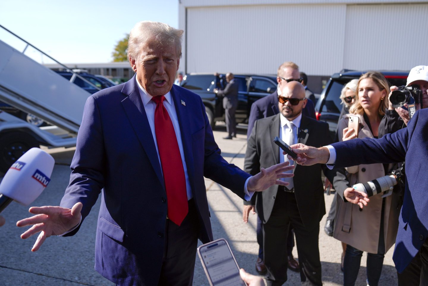 Republican presidential nominee former President Donald Trump speaks to reporters.
