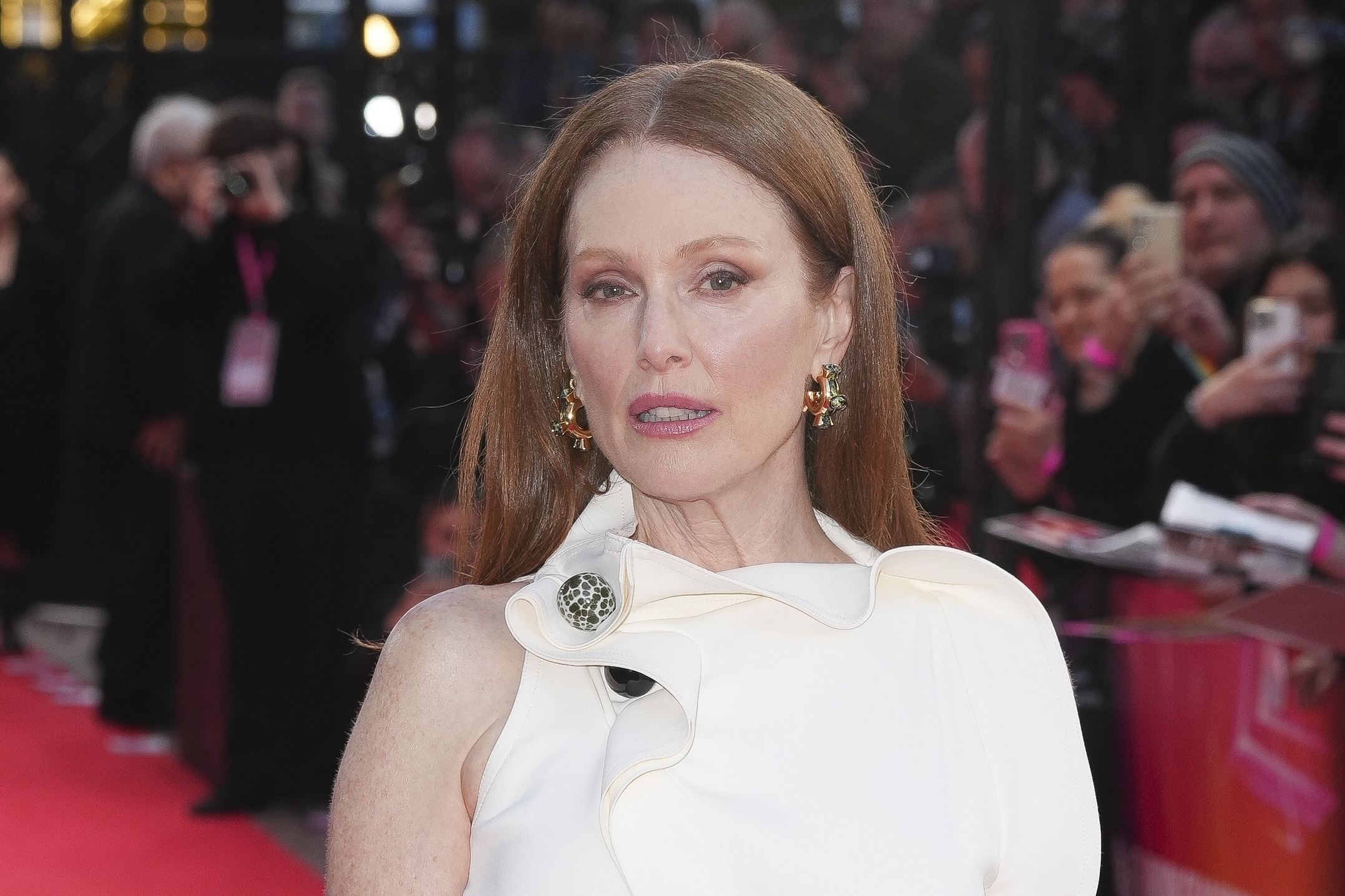 Julianne Moore poses for photographers
