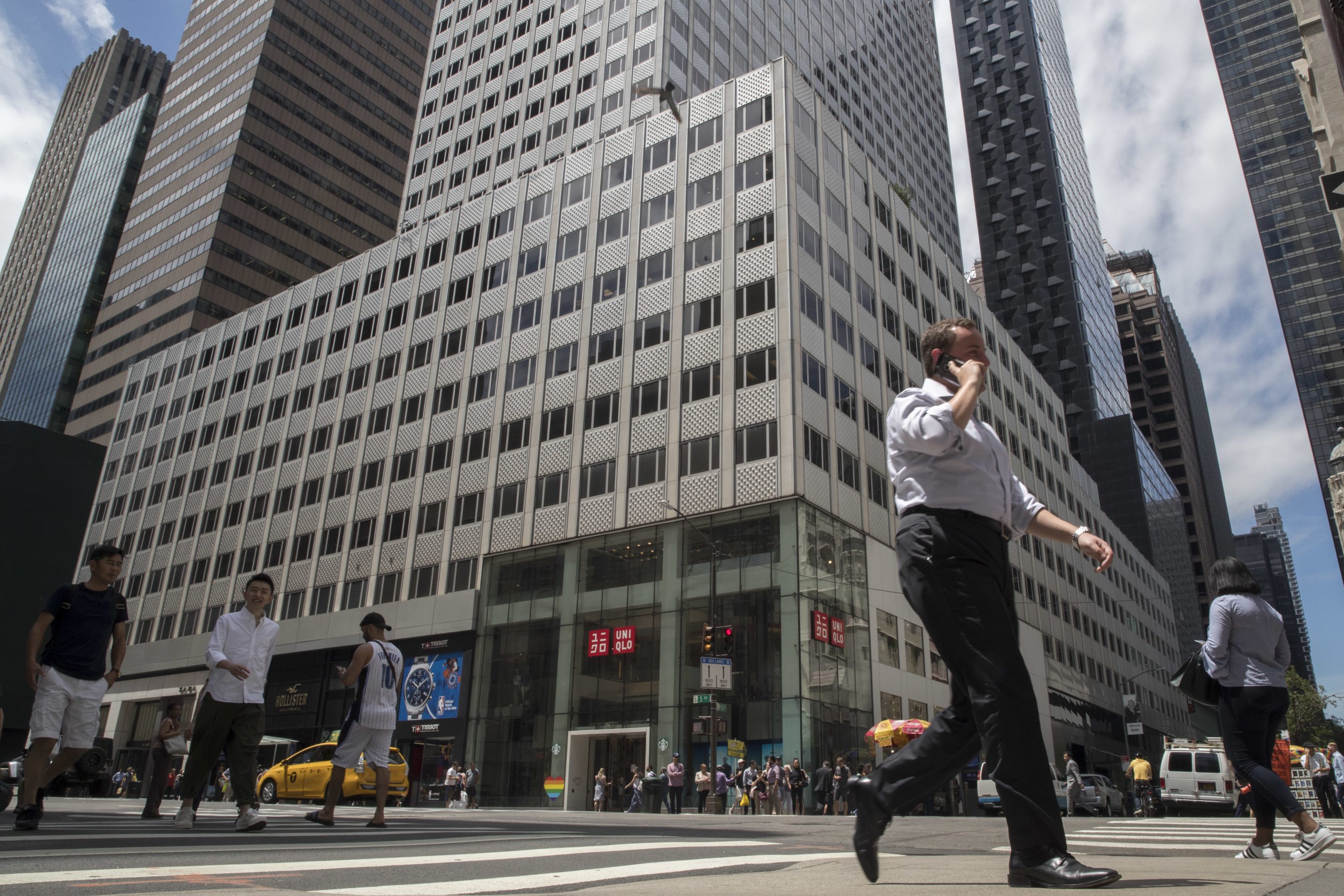 Pedestrians walk past 666 Fifth Avenue, June 20, 2018, in New York.