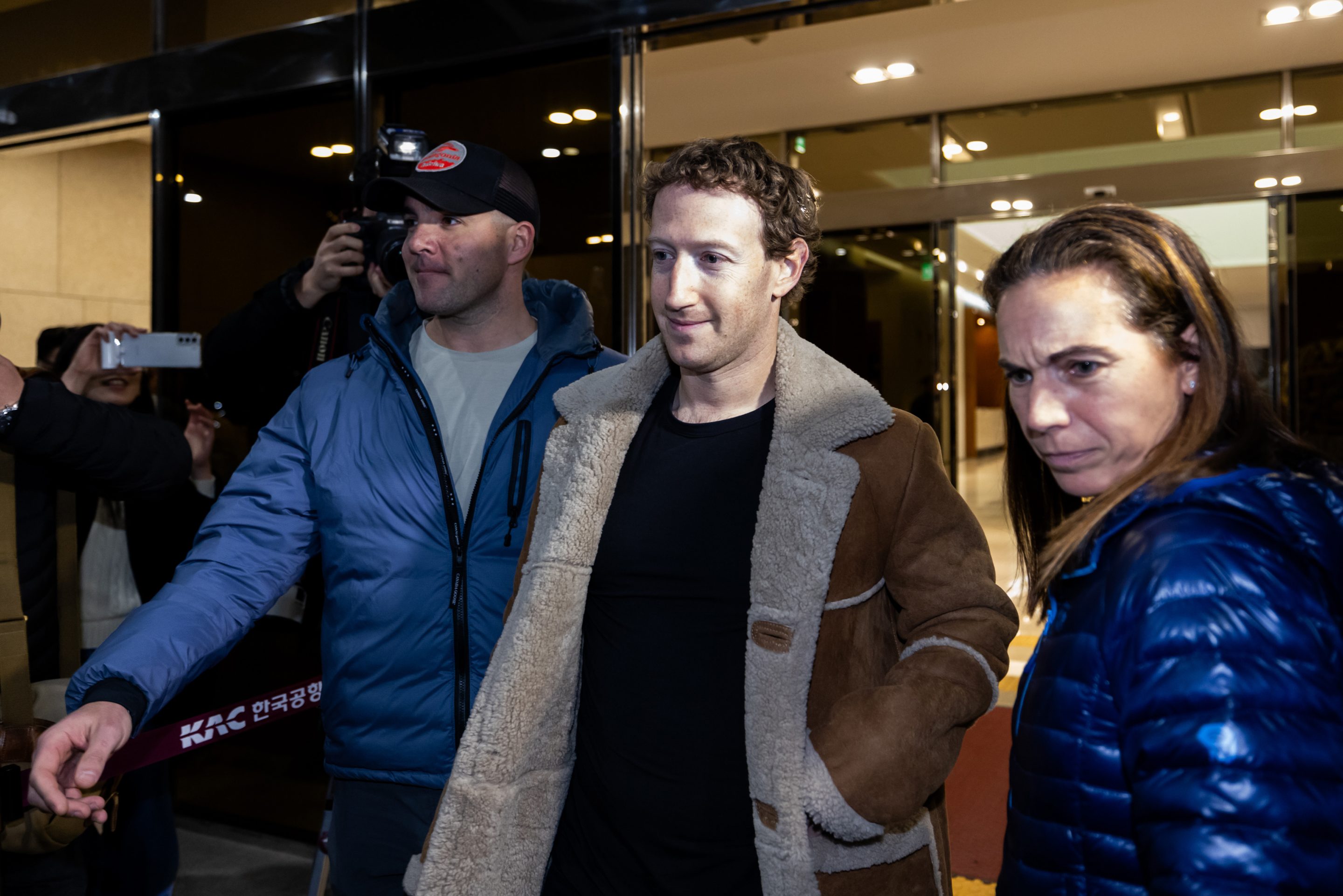 Photo of Mark Zuckerberg walking through an airport