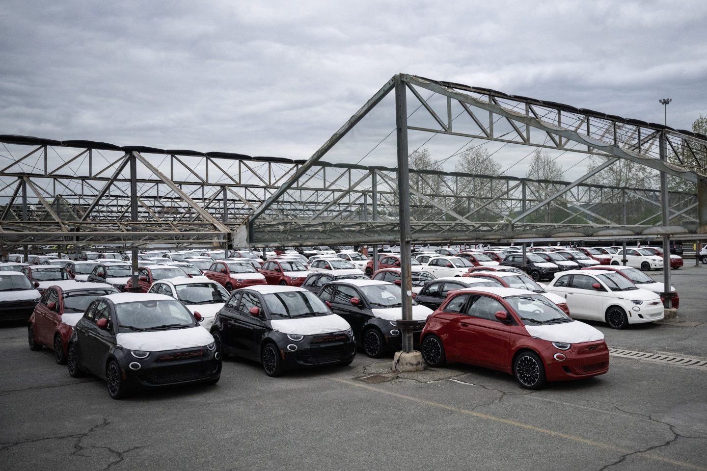 Fiat 500 are parked at the Mirafiori Stellantis' factory in Turin, on April 10, 2024. To meet the growing demand for electrified vehicles and the ambitious targets presented in the Dare Forward 2030 strategic plan, Stellantis and its joint venture partner, Punch Powertrain, signed a new agreement increasing production of the future-generation electrified dual-clutch transmissions (eDCT) for Stellantis hybrid and plug-in hybrid electric vehicles (PHEV).