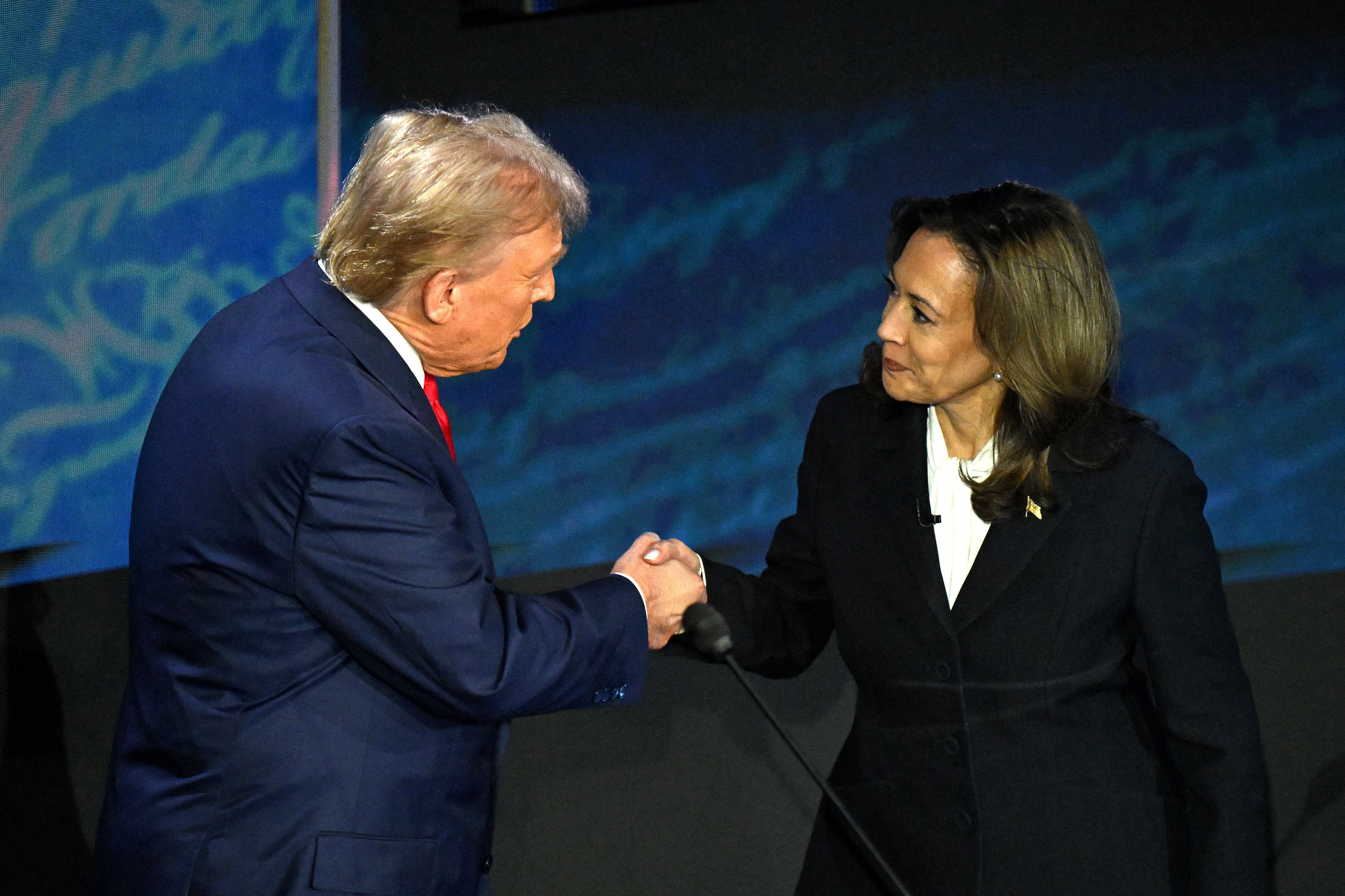 Kamala Harris (right) shakes hands with Donald Trump on Sept. 10