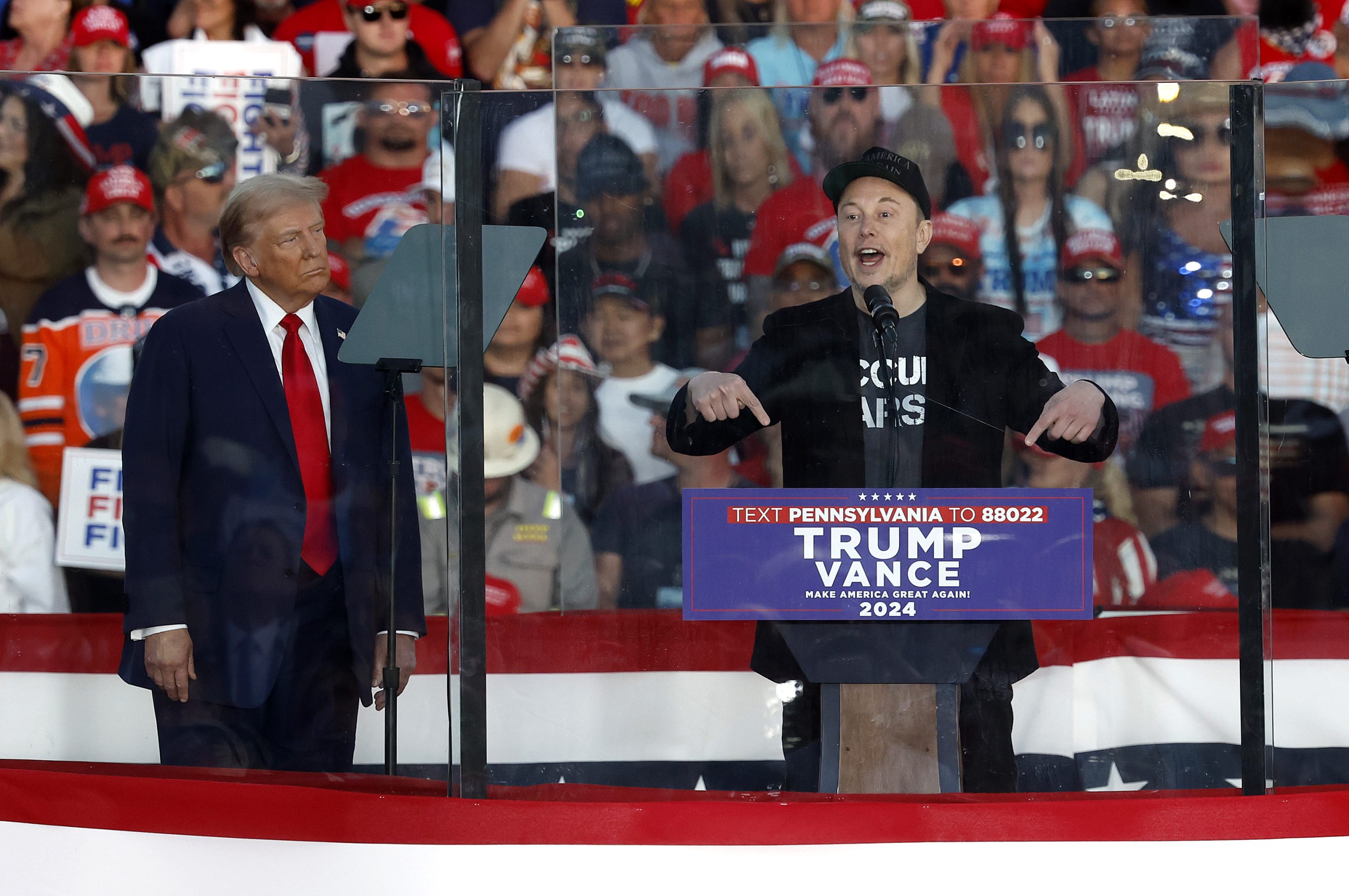 Tesla CEO Elon Musk (right) endorses the Republican presidential nominee, former President Donald Trump, during a campaign rally at the Butler Farm Show fairgrounds on Oct. 5, 2024, in Butler, Pa.