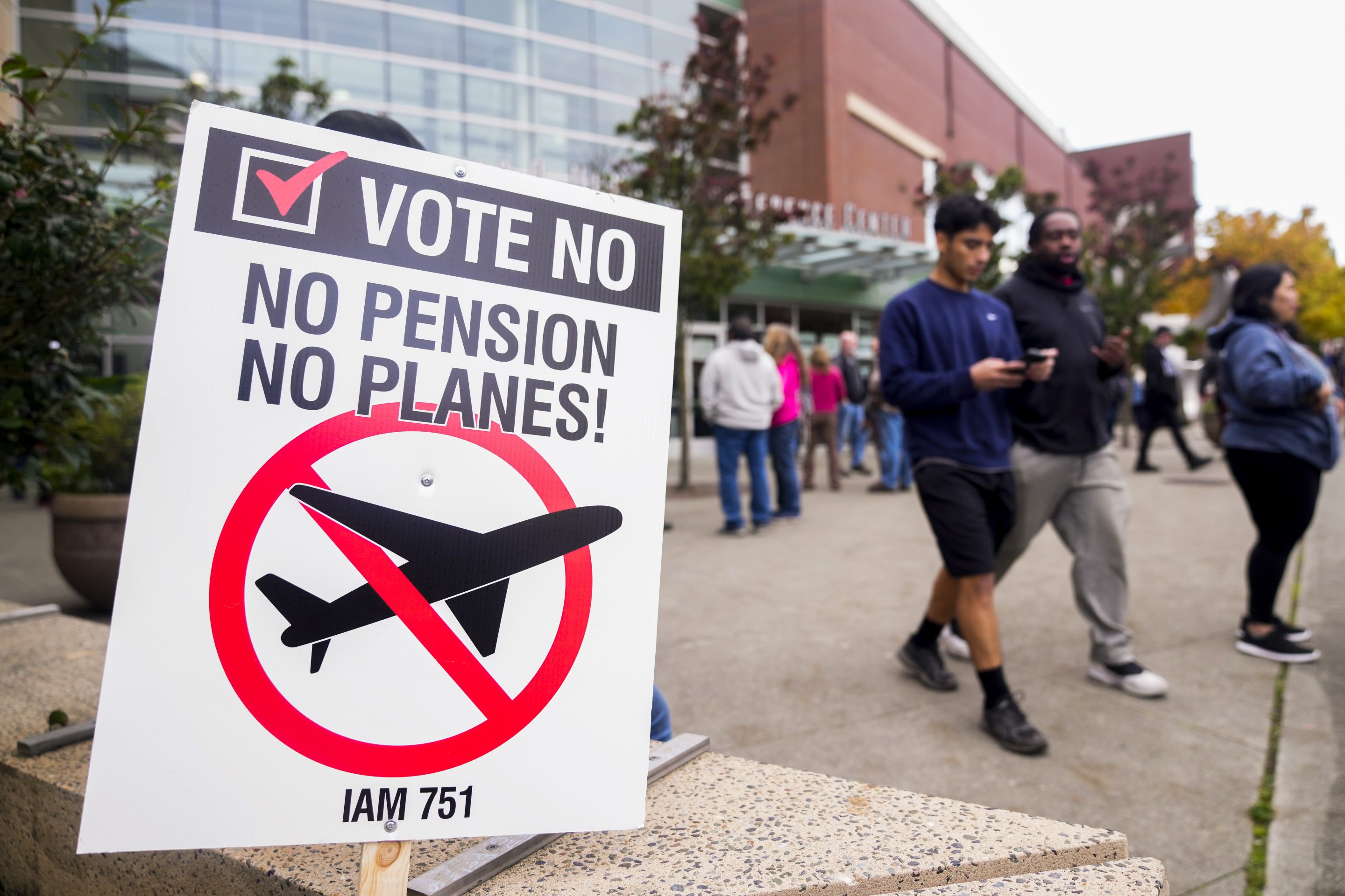 A picket sign sits outside the Angel of the Winds Arena as striking Boeing employees gather to cast their votes, on Oct. 23, 2024, in Everett, Wash.