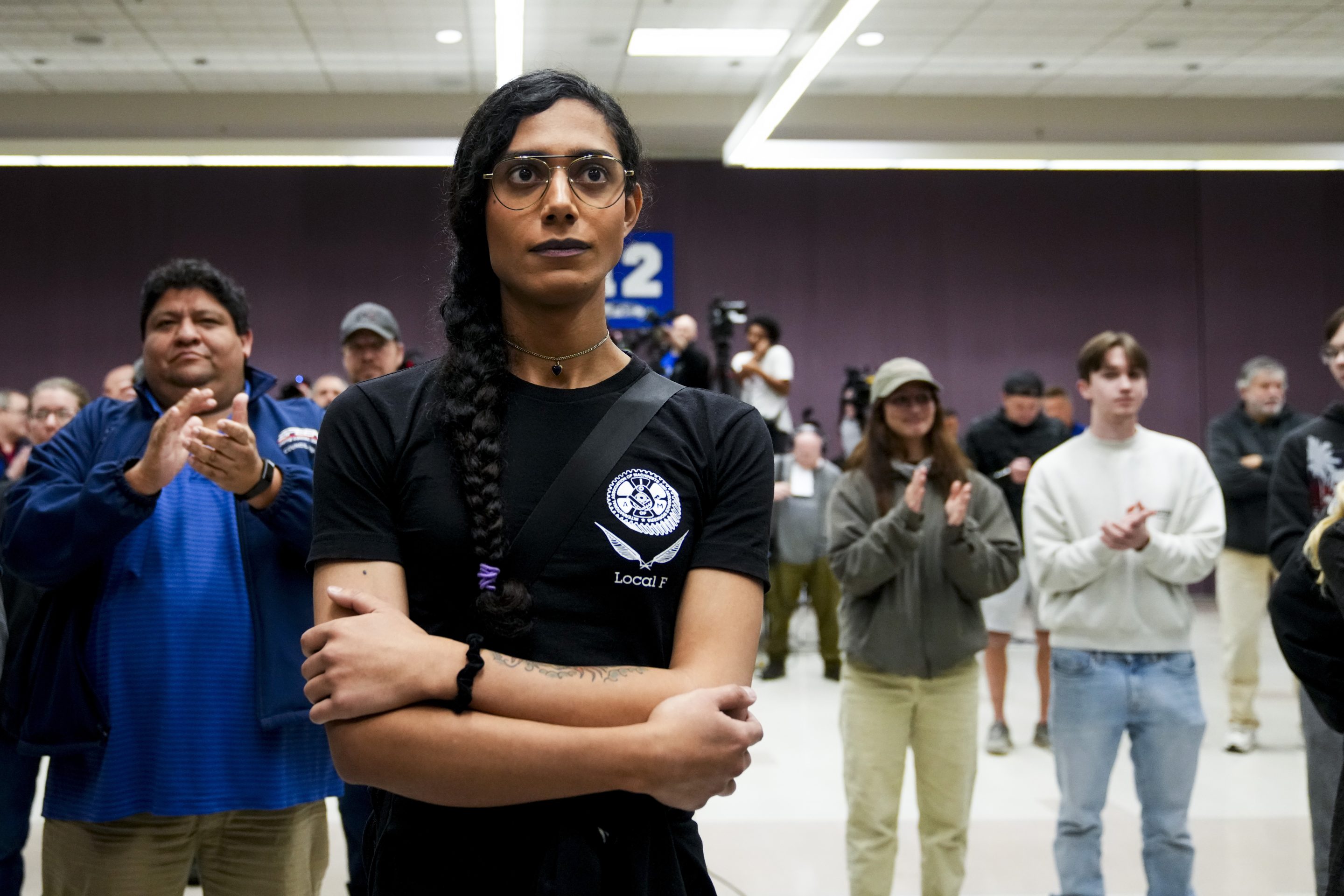 Eep Bolaño listens as IAM District 751 president Jon Holden announces that the union voted to accept a new contract offer from Boeing,on Nov. 4, 2024, at their union hall in Seattle.
