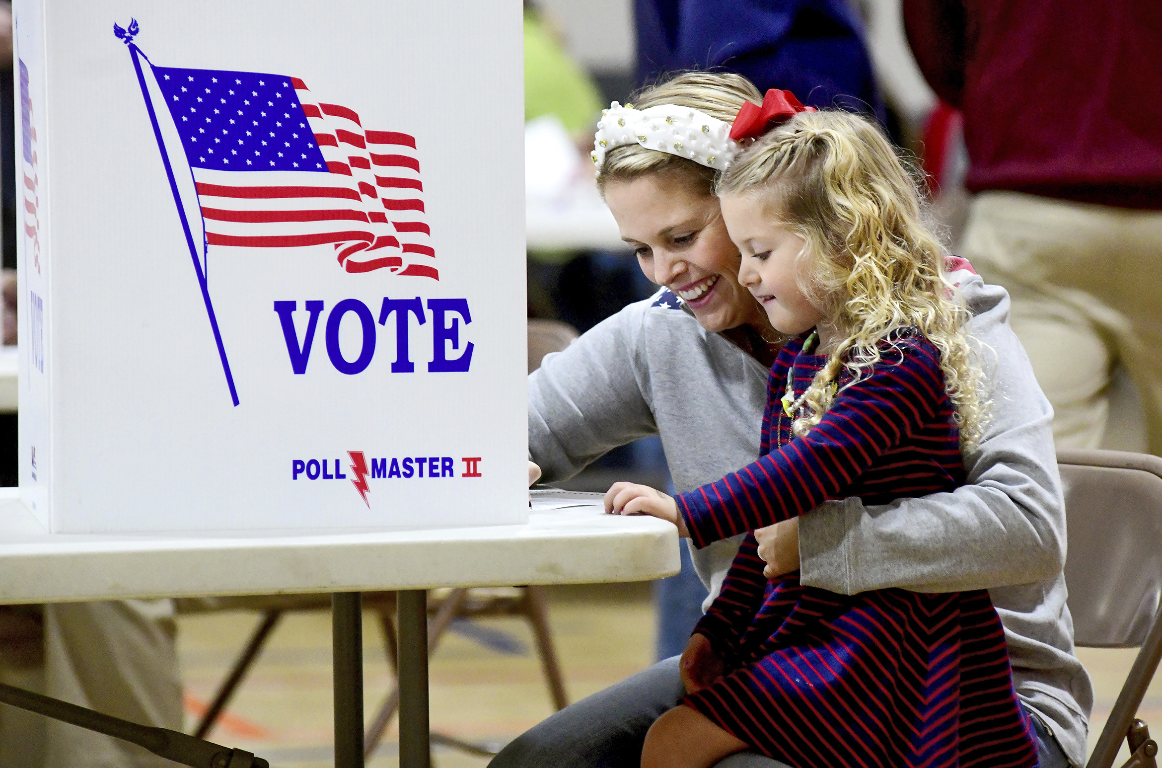 Kate Aurandt-Gribbler holds her daughter, Olivia Gribbler, 3, as she votes at the Westmont Borough No. 1 polling place at Westmont Grove in Johnstown, Pa., in
Cambria County, on Nov. 5, 2024.