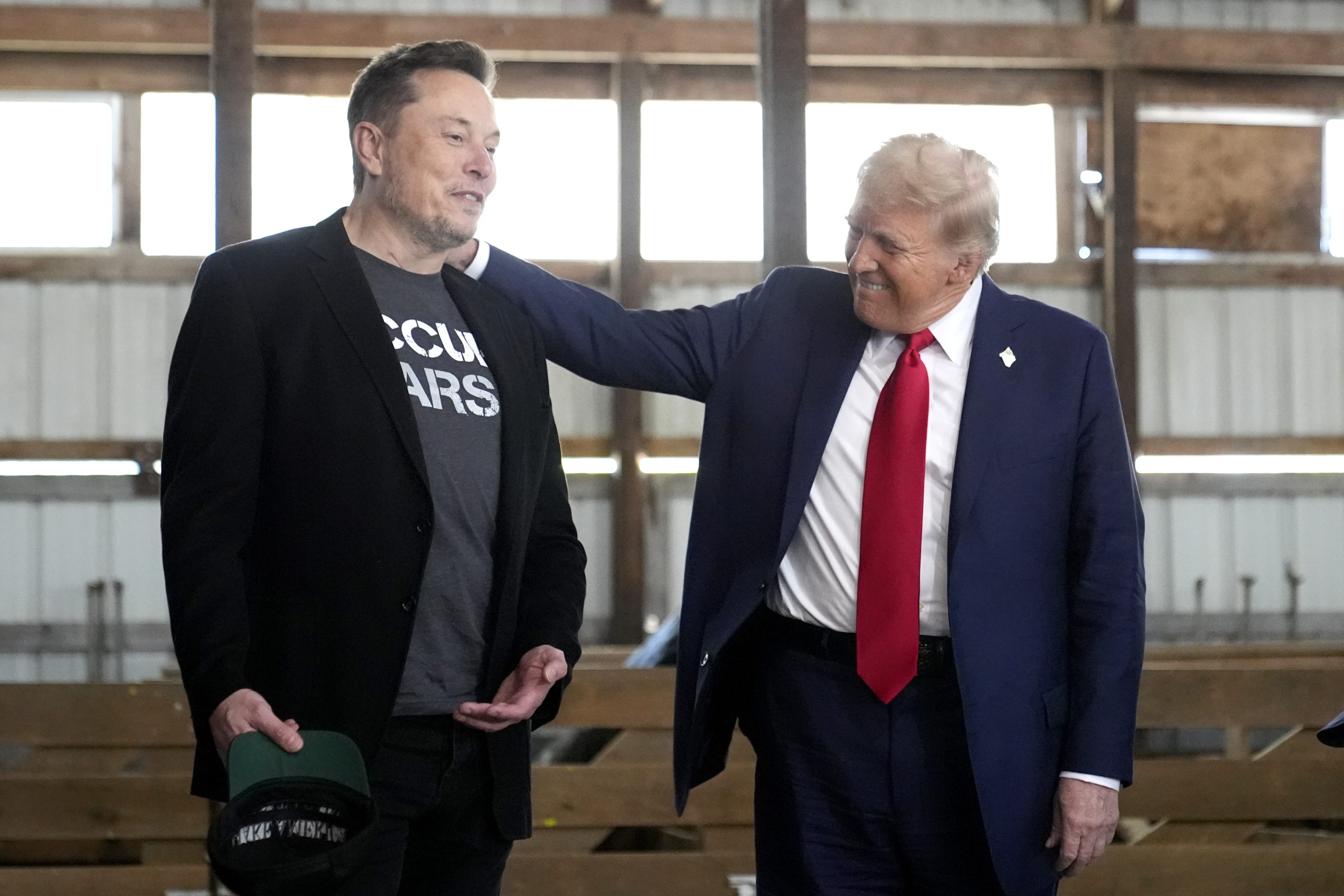 Tesla and SpaceX CEO Elon Musk, left, and Republican presidential nominee former President Donald Trump attend a campaign event at the Butler Farm Show on Oct. 5, 2024, in Butler, Pa.