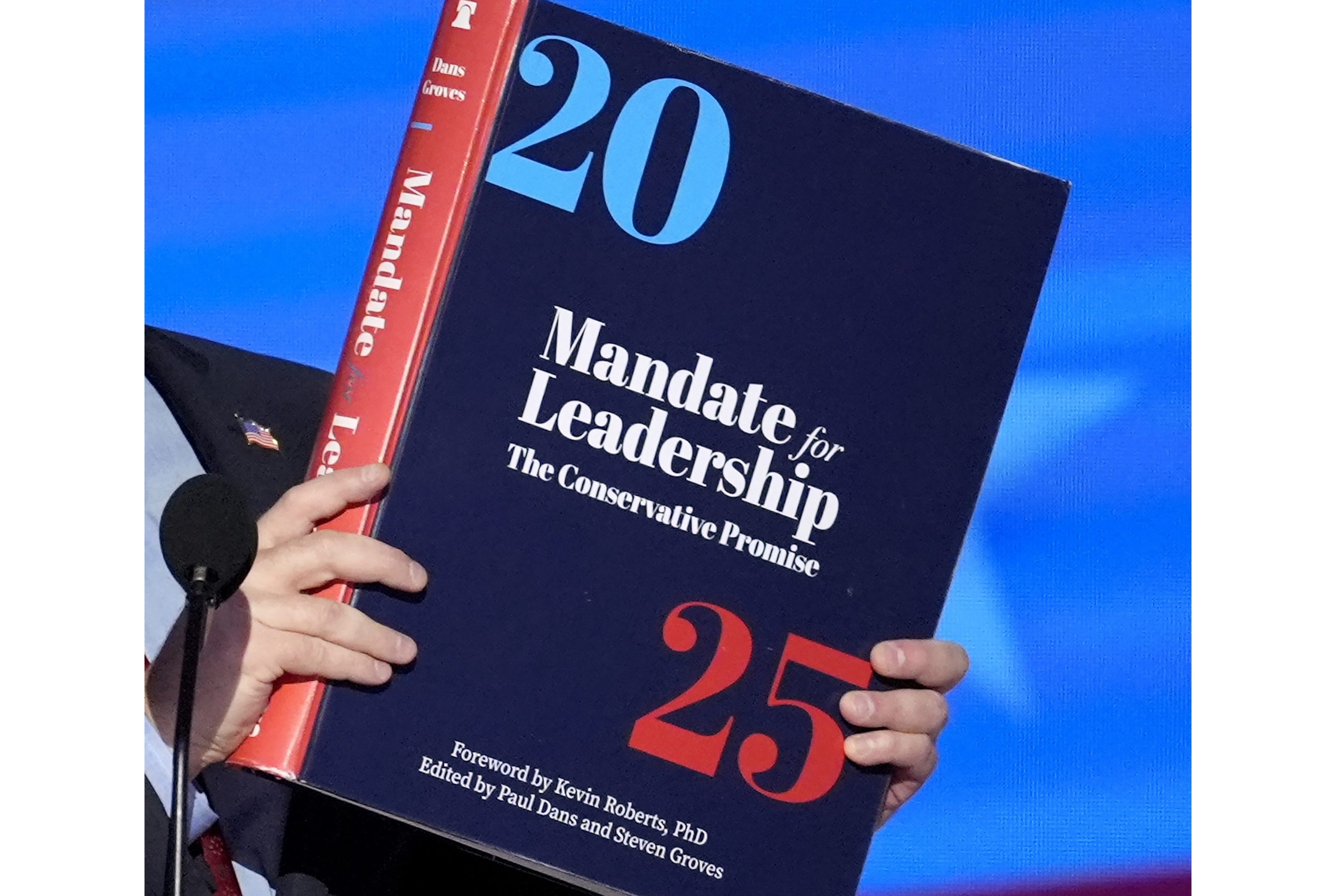 A copy of Project 2025 is held during the Democratic National Convention on Aug. 21 in Chicago.