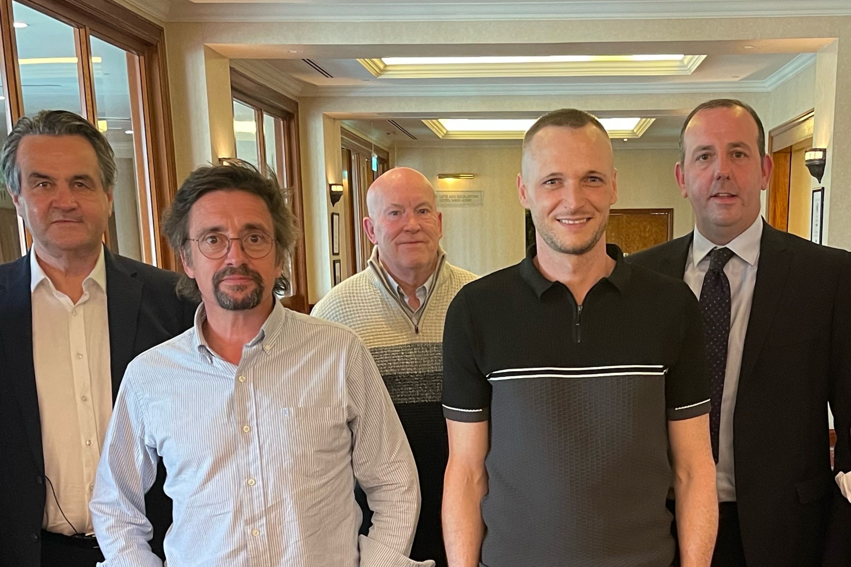 James Howells (front right) pictured with Top Gear presenter Richard Hammond (front left) when the pair met to discuss Howells's lost coins.