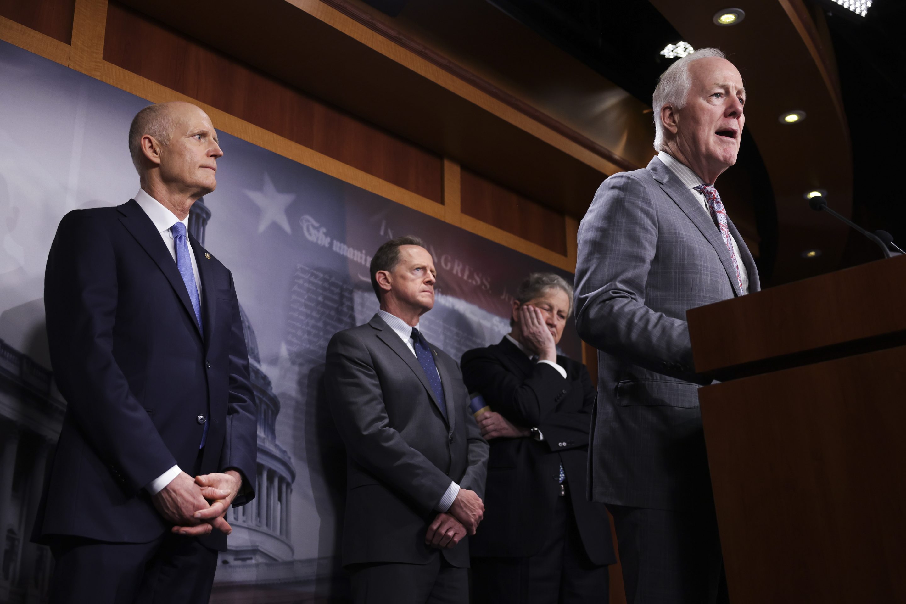 Sen. Rick Scott, far left, and Sen. John Cornyn, far right, at a news conference in 2022.