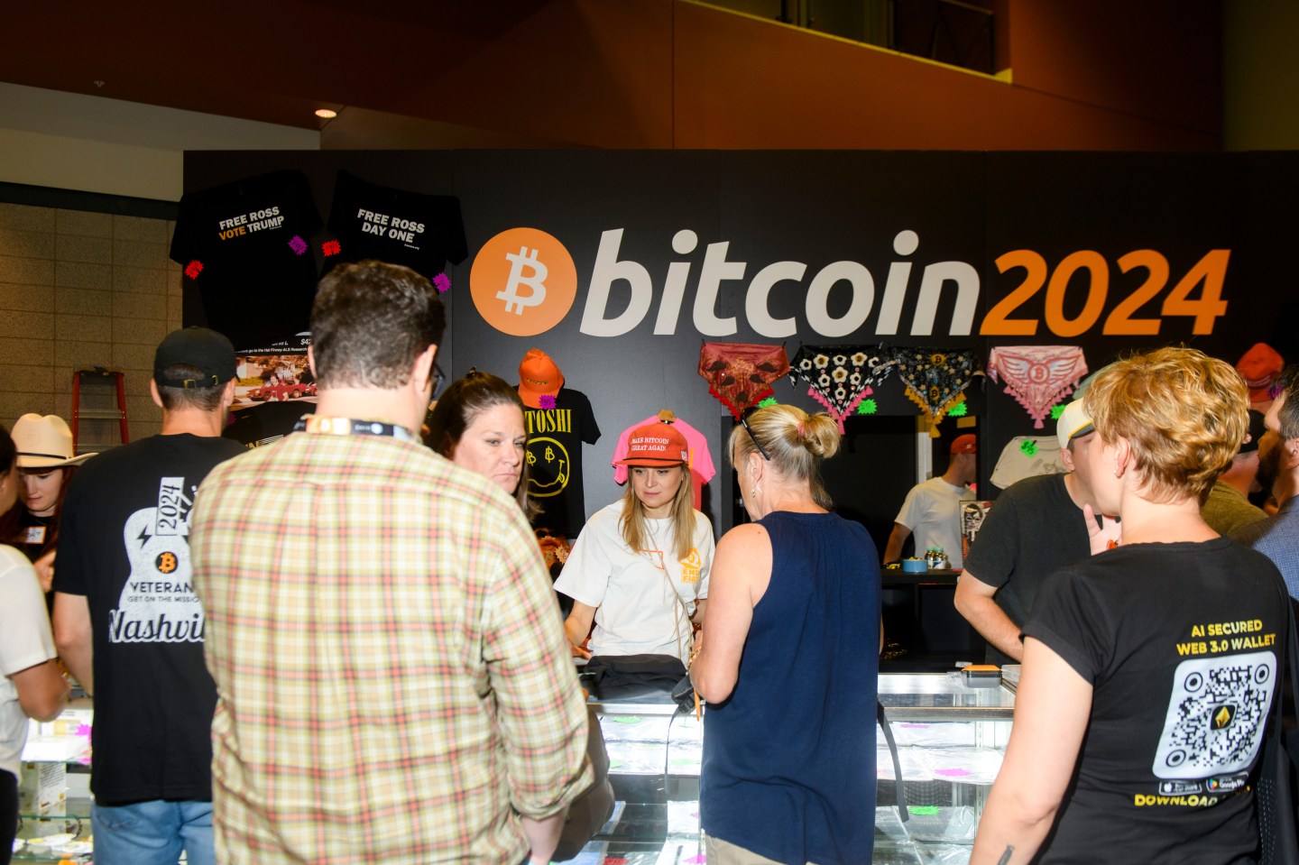 Attendees shop for swag at the Bitcoin 2024 conference in Nashville, Tennessee, US, on Friday, July 26, 2024. 