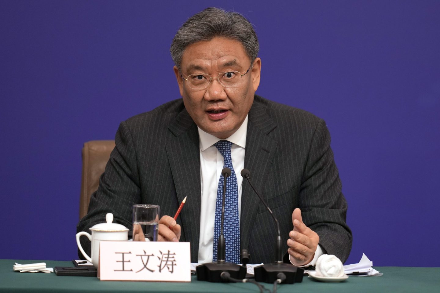 Chinese Commerce Minister Wang Wentao speaks at a press conference on the sideline of the National People's Congress in Beijing, on March 6, 2024. 