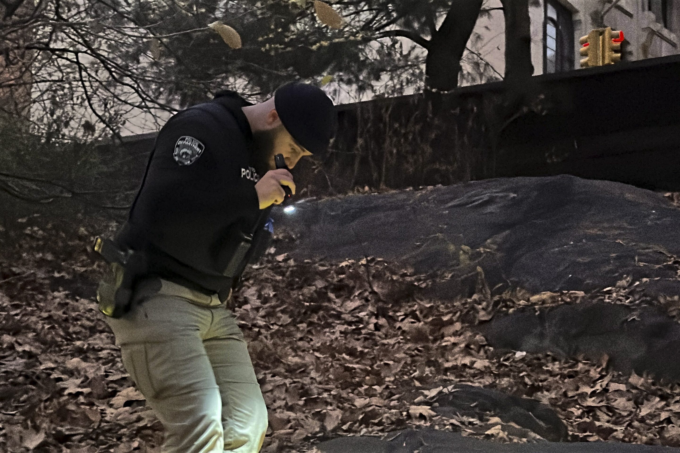 A New York City police officer searching Central Park on Friday.