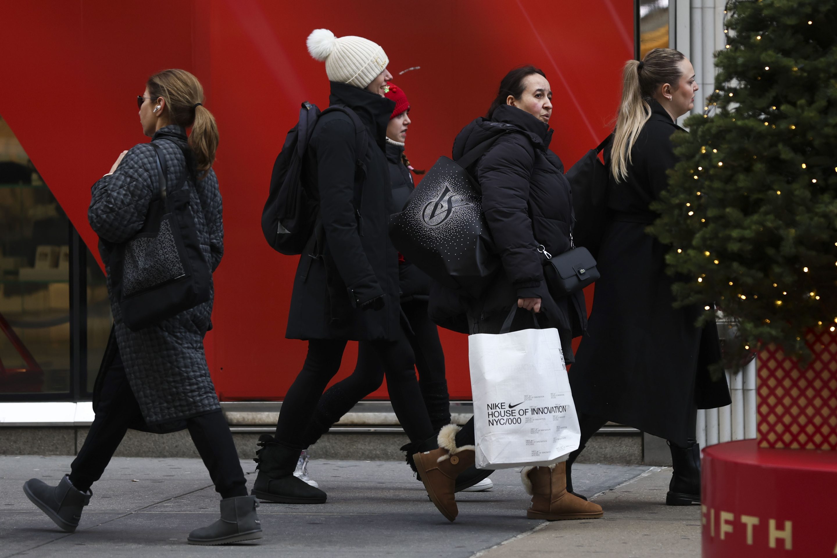Shoppers walk along Fifth Avenue on Nov. 29, 2024, in New York.