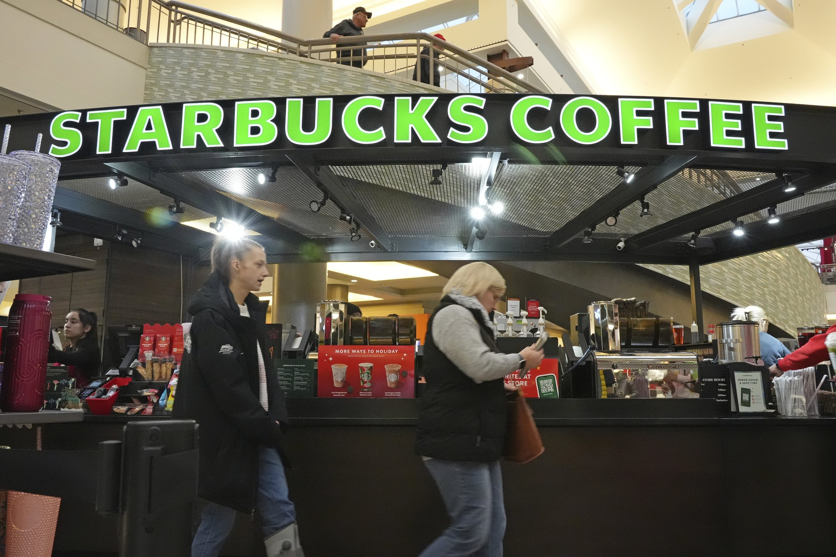 Shoppers at the Walden Galleria in Buffalo, NY, stop by the Starbucks kiosk on Nov. 30, 2024.