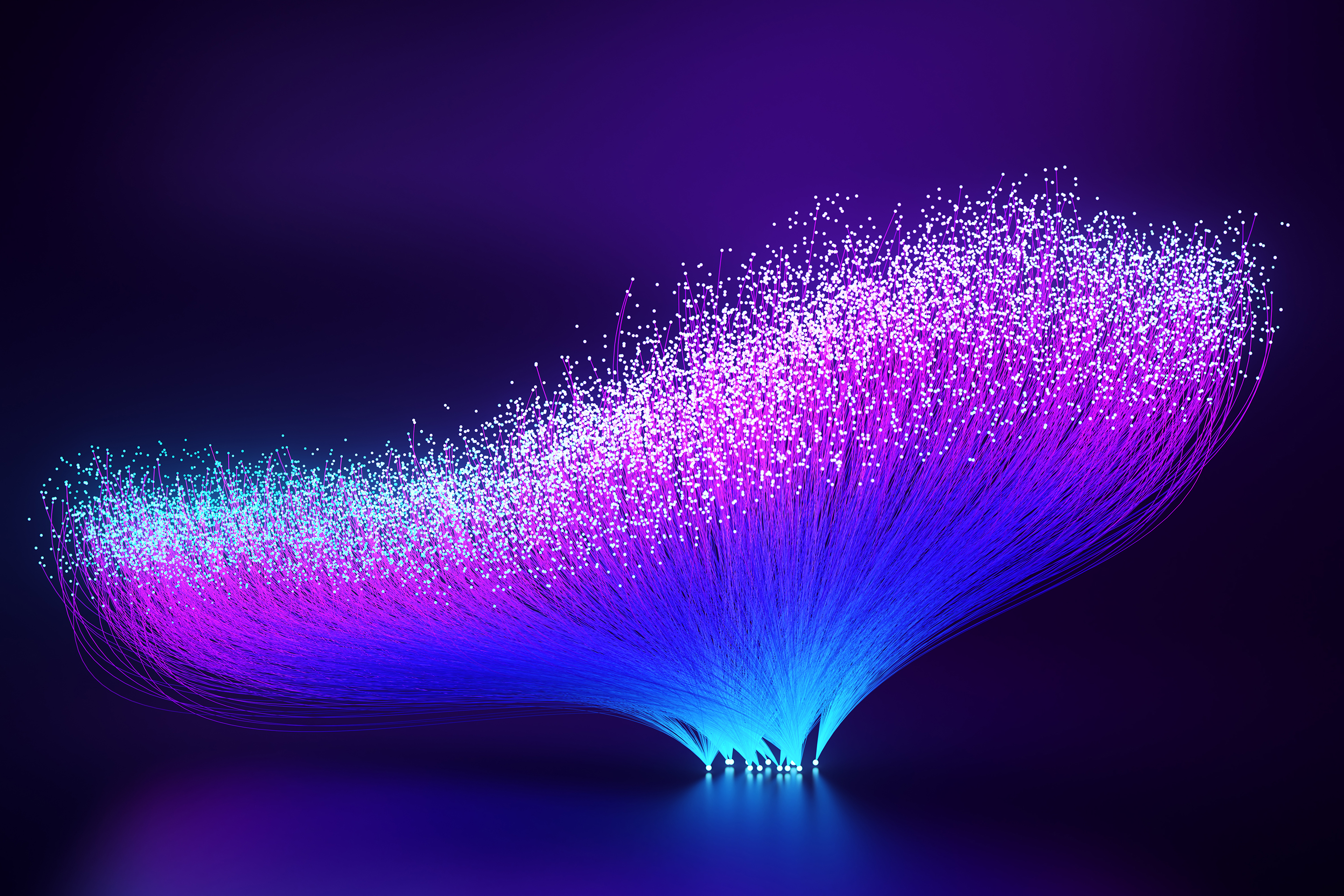 Digitally generated images of vibrant, abstract fiber optics radiating outwards into the abyss.