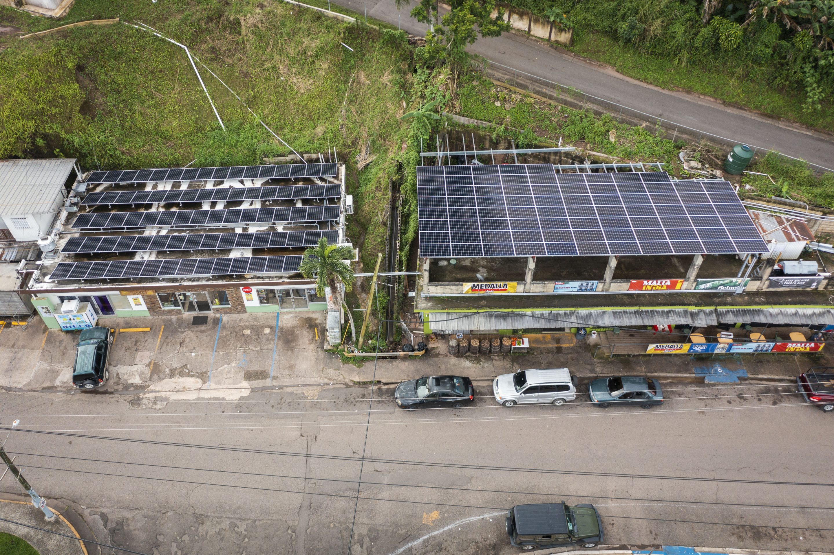 Solar panels on the roof of businesses contribute to the microgrid local power network in Castaner, Puerto Rico, on Nov. 14, 2022.