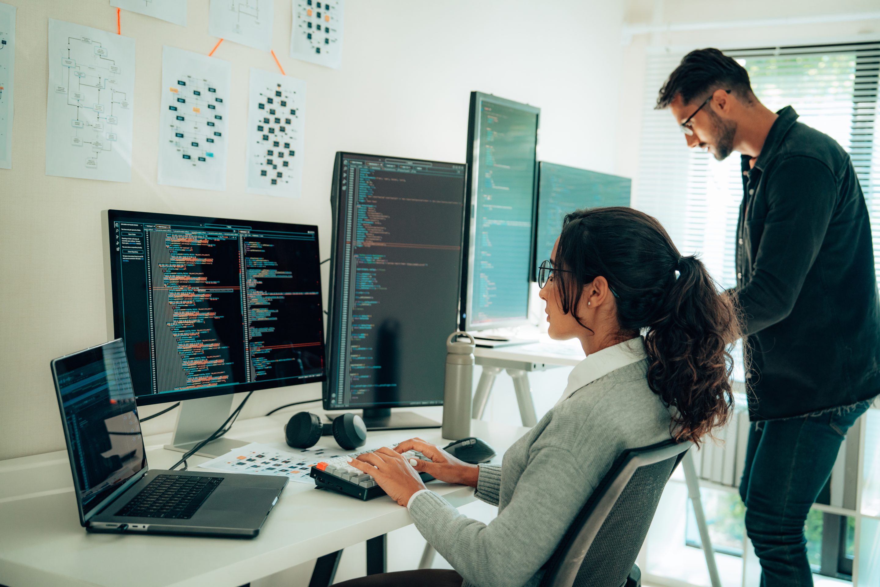 Coders looking at the computer and typing