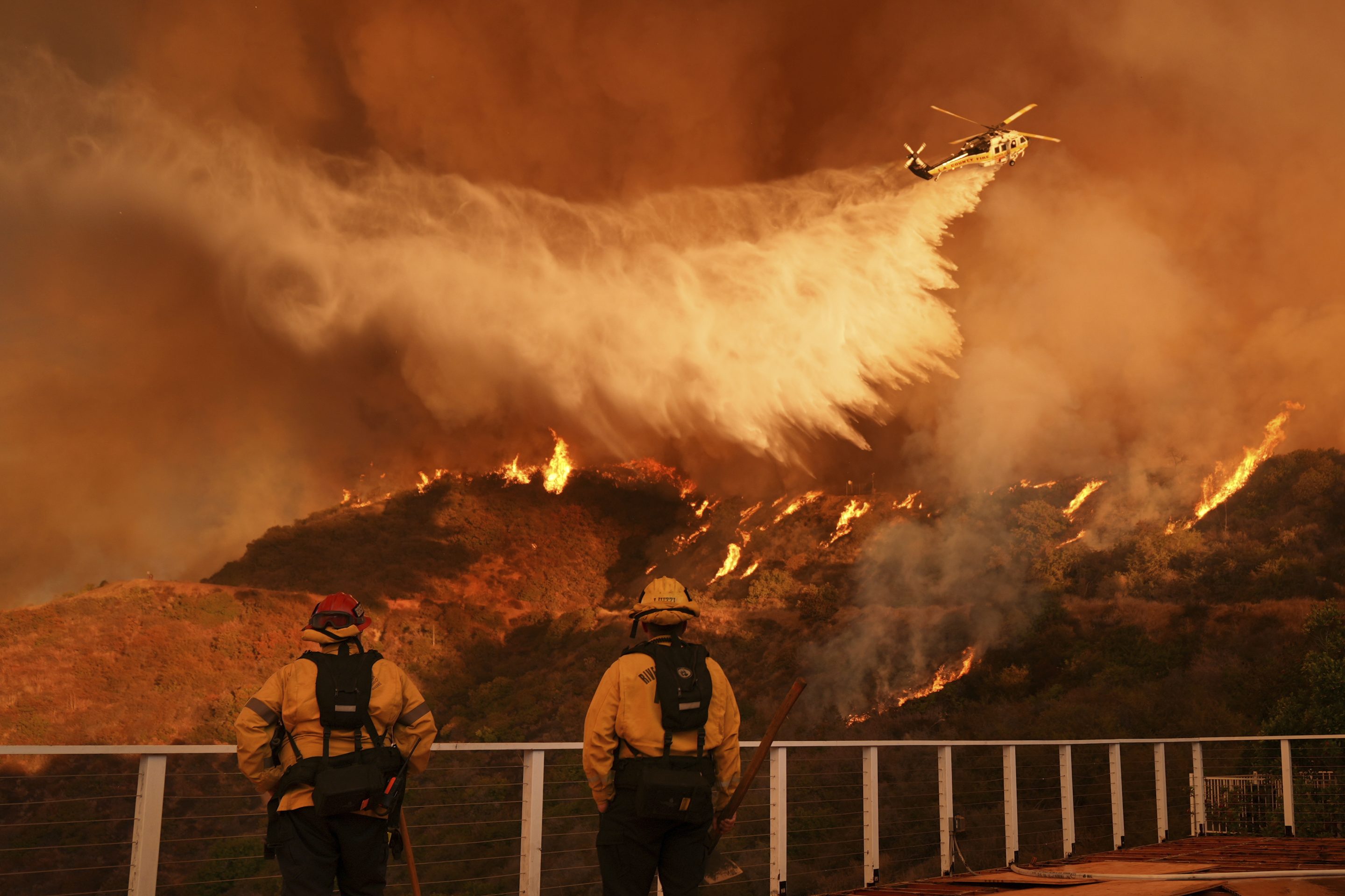 Water is dropped on the Palisades Fire in Mandeville Canyon Saturday.