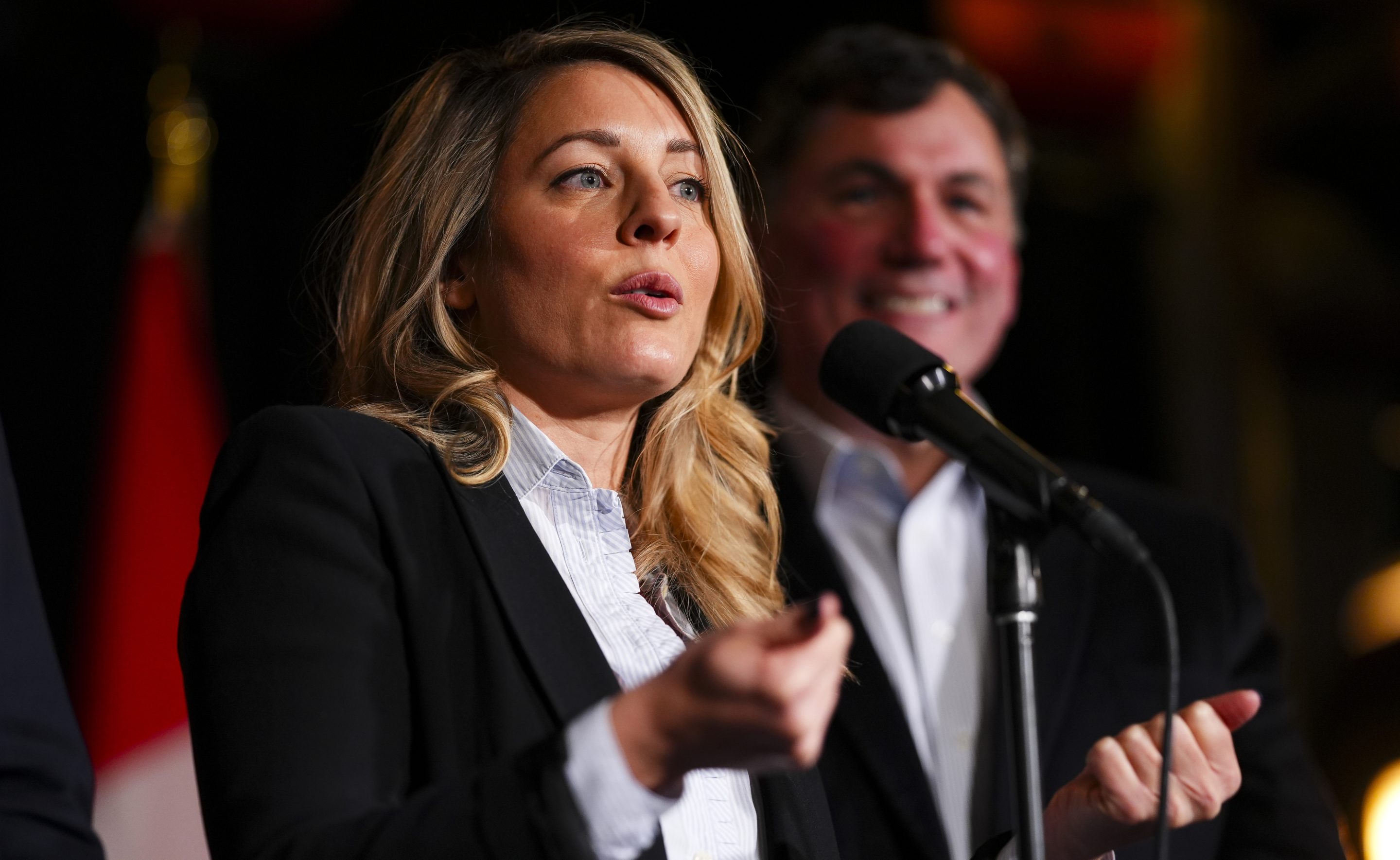 Canada's Minister of Foreign Affairs Melanie Joly and Minister of Finance and Intergovernmental Affairs Dominic LeBlanc speak to reporters prior to a meeting during a cabinet retreat at Chateau Montebello in Montebello, Quebec, on Jan. 20, 2025.