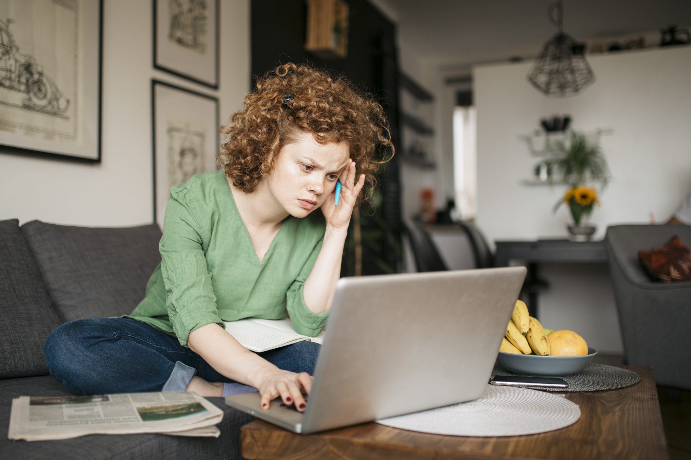 Frustrated job seeker searches for roles on computer.