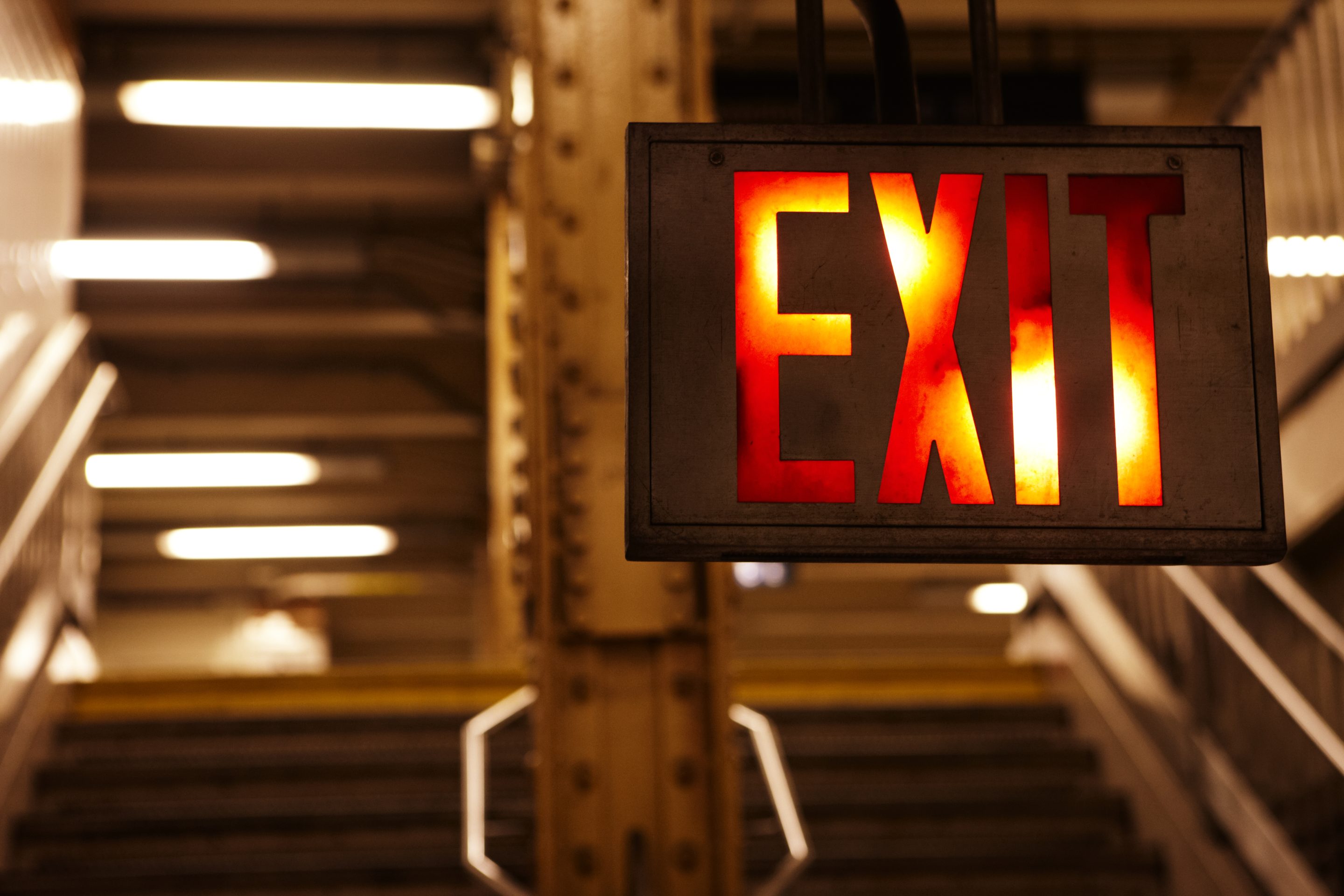 exit sign inside of a subway station