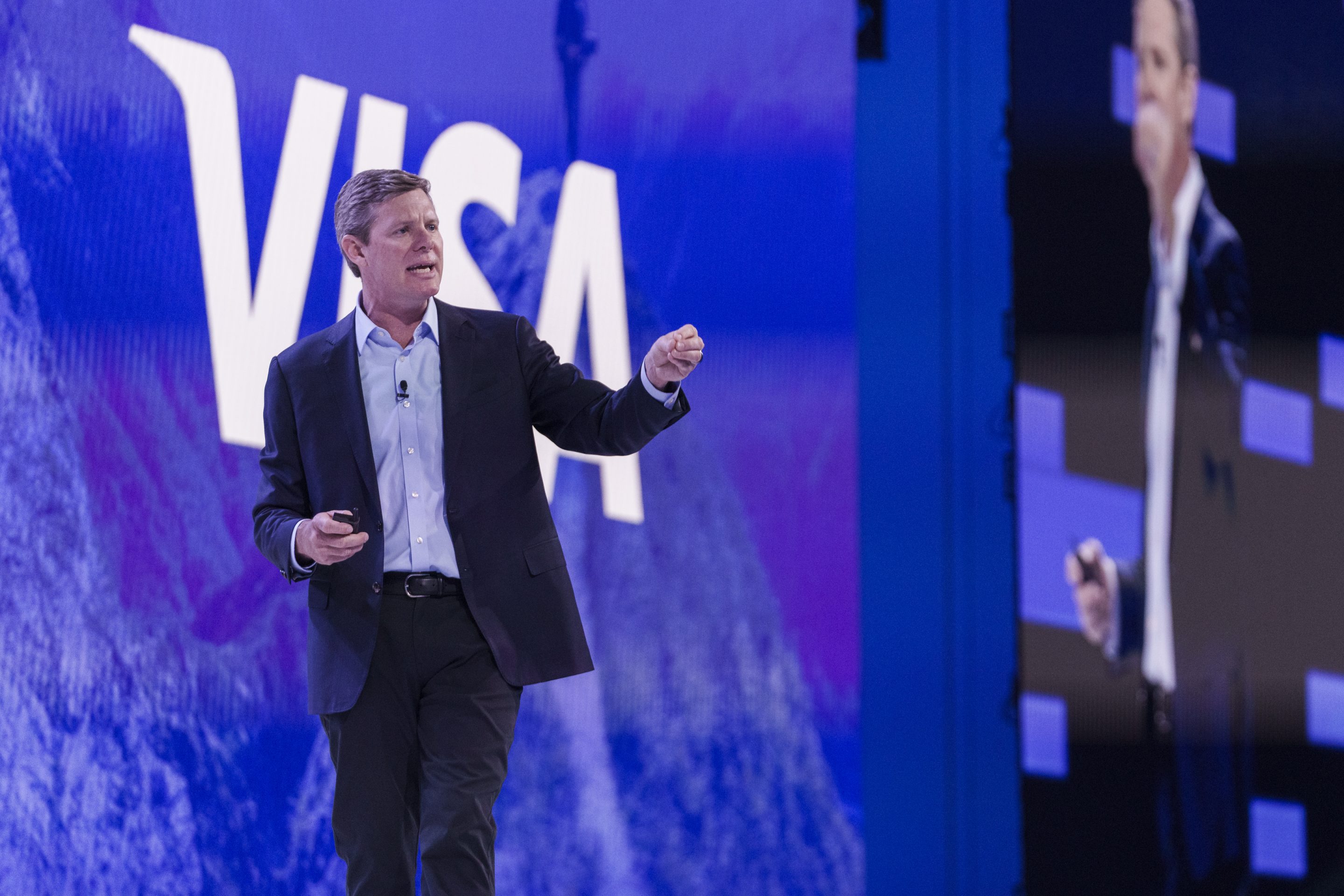 Ryan McInerney on stage at a VISA conference.