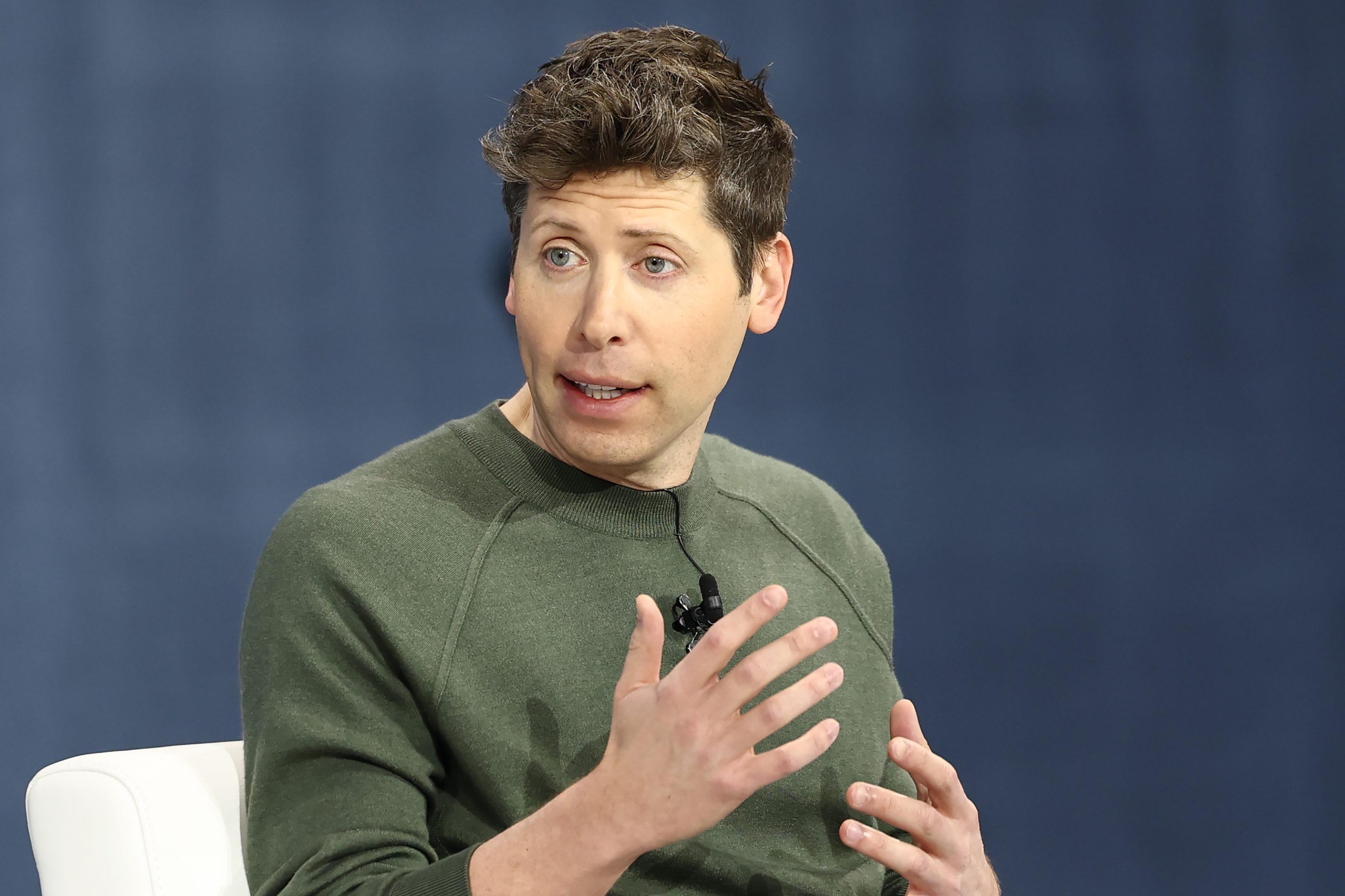 Sam Altman gesticulates during the NYT Dealbook Summit