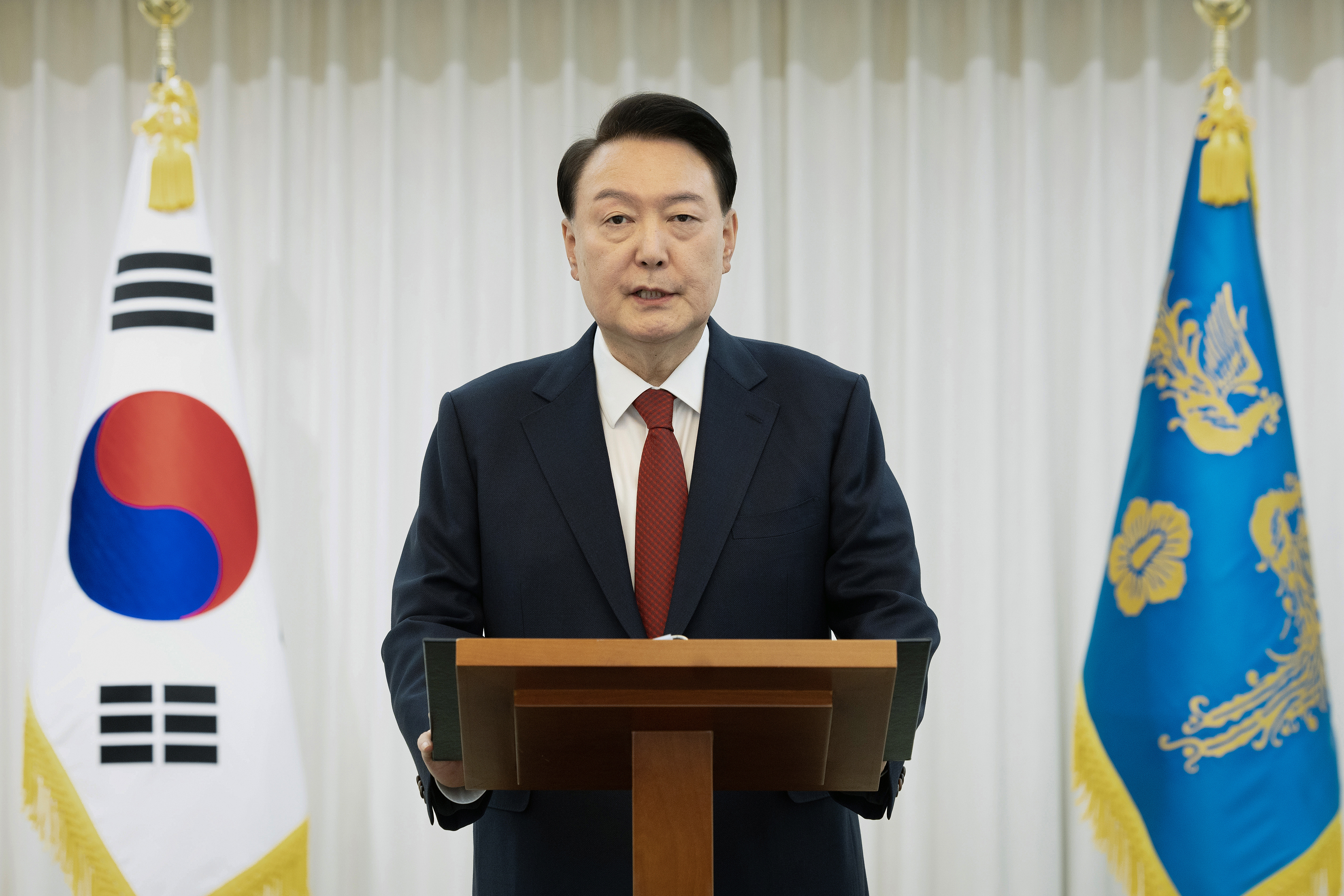 SEOUL, SOUTH KOREA - DECEMBER 14: In this handout photo provided by the South Korean Presidential Office, South Korean President Yoon Suk-Yeol speaks to the nation at the Presidential Office on December 14, 2024 in Seoul, South Korea. The National Assembly voted Saturday to impeach President Yoon Suk Yeol over his botched imposition of martial law, suspending him from his duties until the Constitutional Court decides whether to reinstate him or remove him from office. (Photo by South Korean Presidential Office via Getty Images)