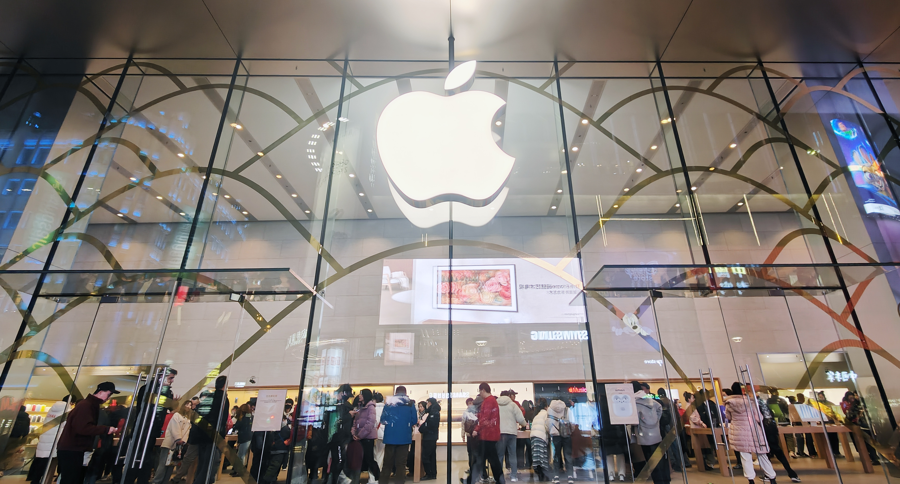 Customers gather at an Apple store in Shanghai, China, on Jan. 4, 2025.