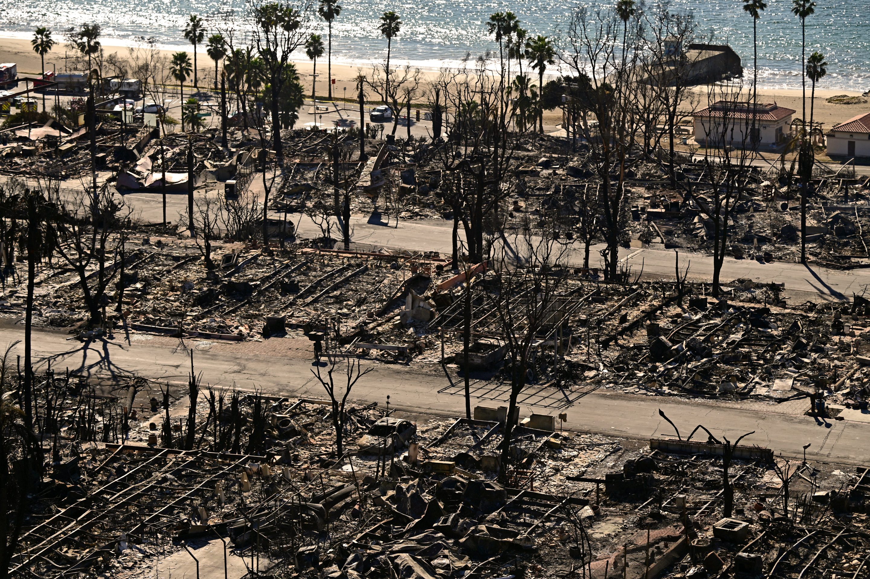 Charred homes and burnt cars are pictured amid the rubble of the fire-ravaged Pacific Palisades Bowl Mobile Estates on Monday.