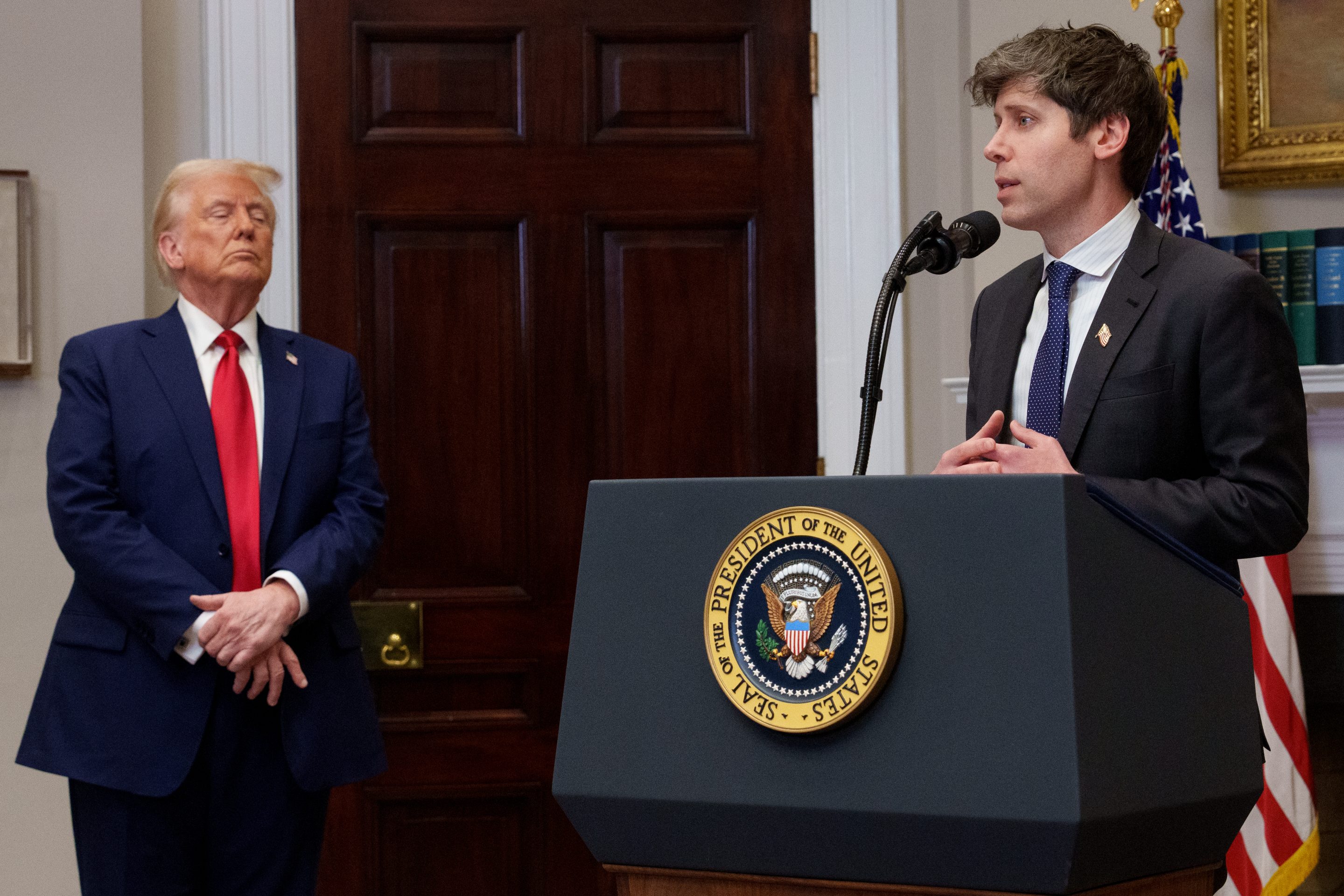 "He hates one of the people in the deal," Trump said when asked whether Musk's criticism bothered him. He seemed to be referring to OpenAI CEO Sam Altman (right).