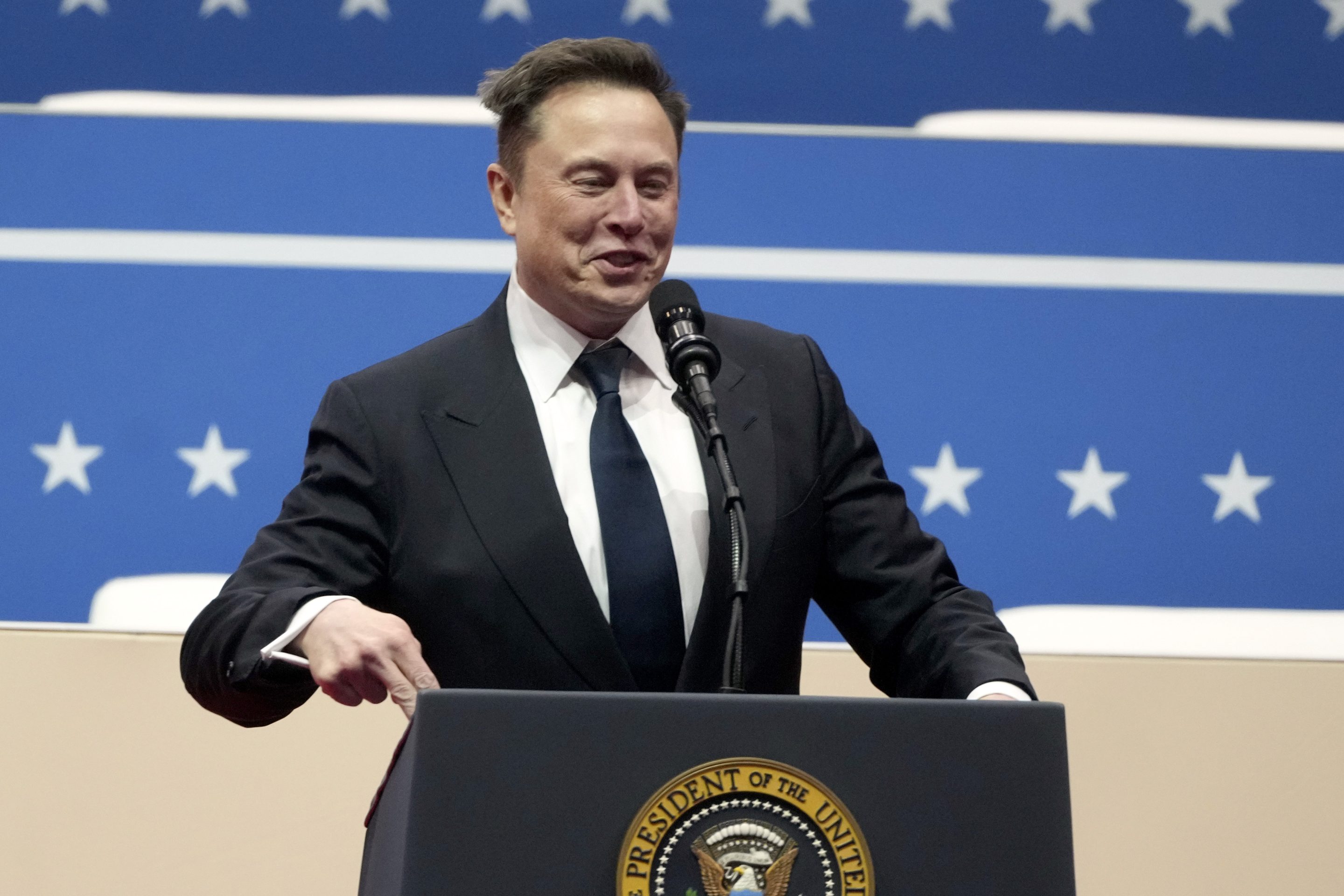 Elon Musk speaks at an indoor Presidential Inauguration parade event in Washington, Jan. 20, 2025.