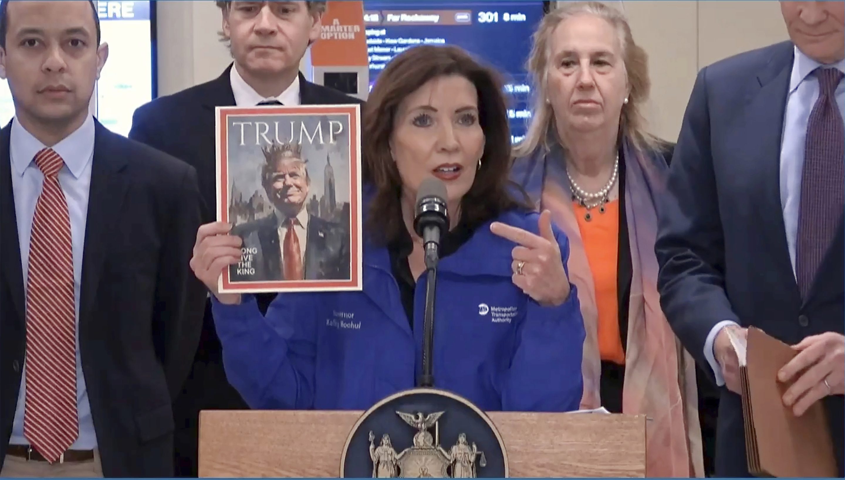 New York Gov. Kathy Hochul holds a mock magazine cover during an event about congestion pricing at New York's Grand Central Terminal, on Feb. 19, 2025. 